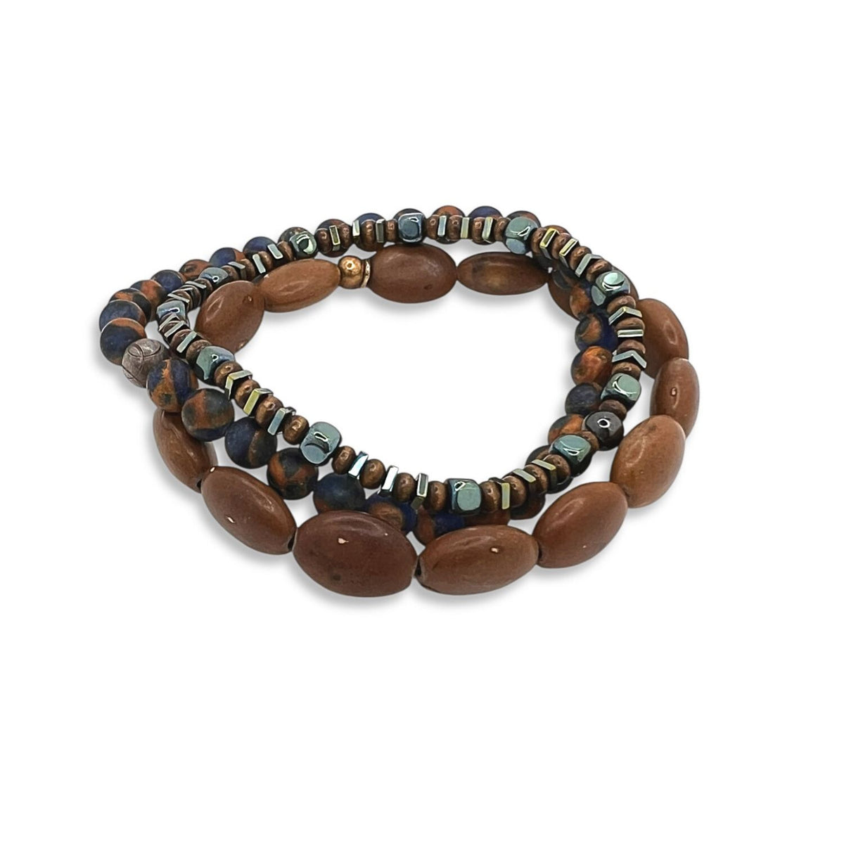 The Coffee King Bracelet Set from JAREDJAMIN Jewelry Online features two coiled strands: one with large oval brown wooden beads, the other with smaller mixed beads in brown, black, blue, metallic tones and accented with freshwater pearls.