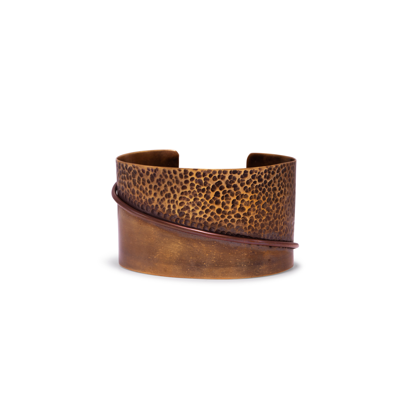 The Tribella Antique Finish Cuff Bracelet by JAREDJAMIN Jewelry Online features a textured, hammered top, a smooth lower half, and a thin raised brass strip diagonally across its bronze finish.