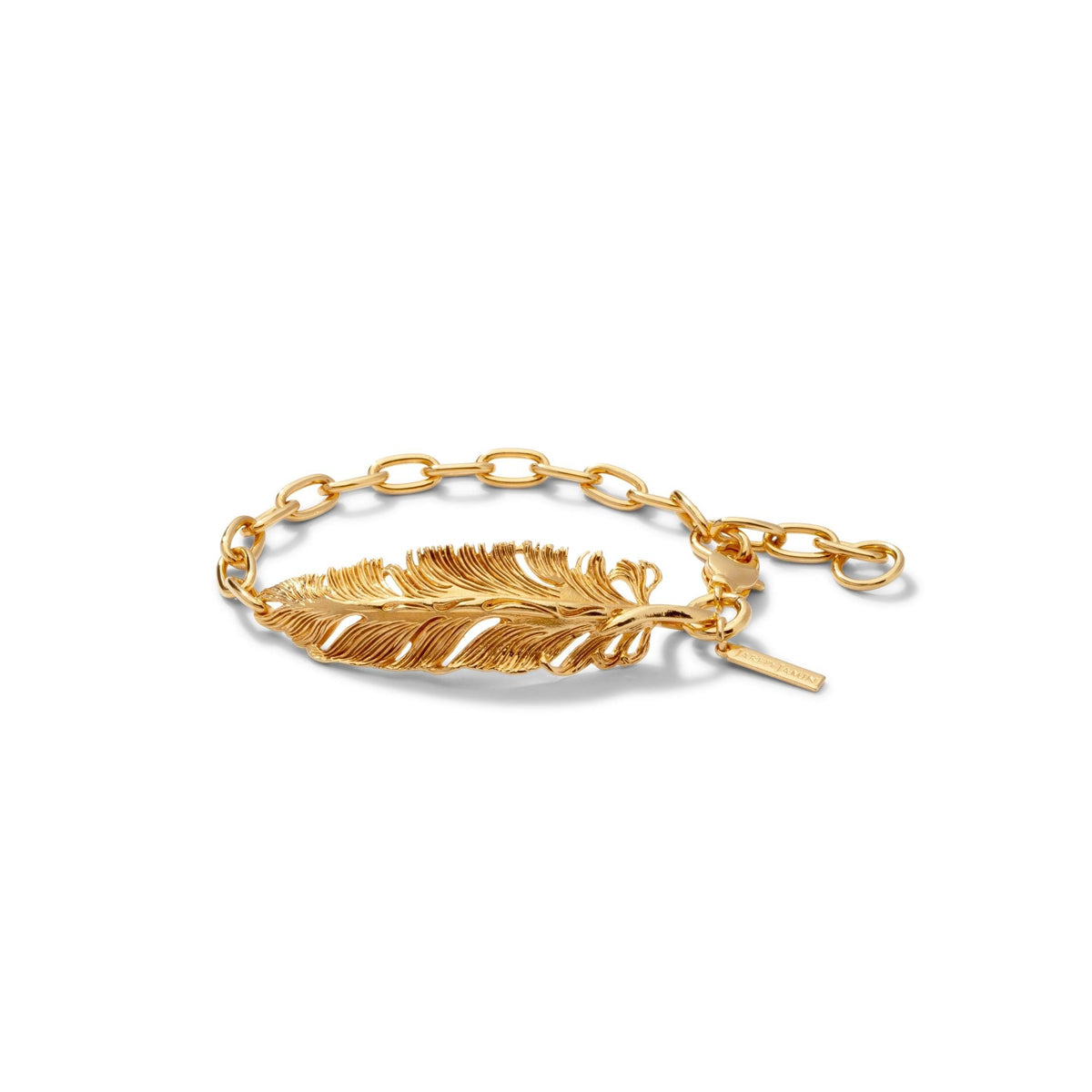 The Gold Feather Plume Bracelet by JAREDJAMIN Jewelry Online features an oversized, detailed feather on a chunky chain with a small rectangular tag for a personalized touch, exuding whimsical elegance against a plain white background.