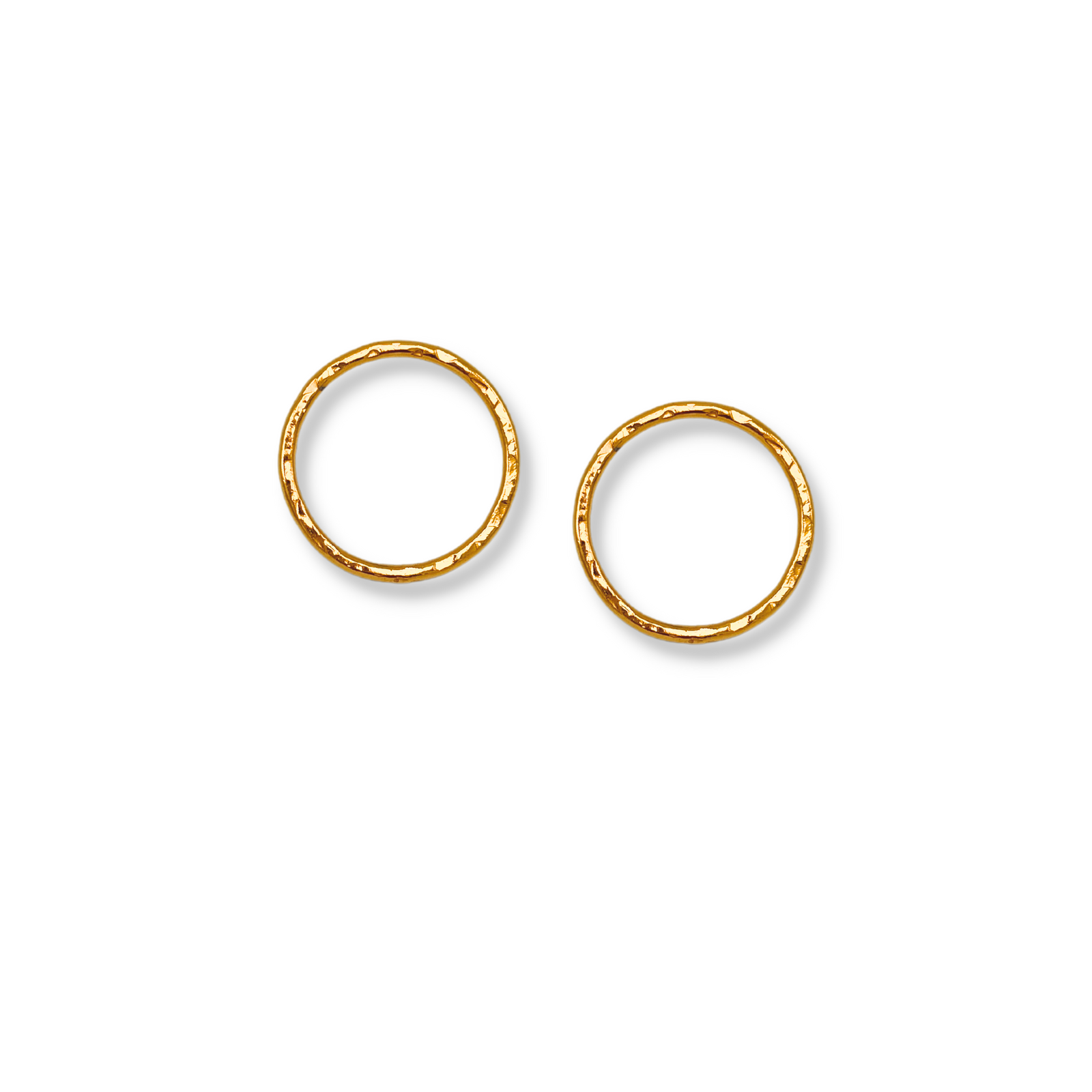 The Medium Rhodri Textured Circular Post Earrings by JAREDJAMIN Jewelry Online, crafted in 18K gold with a hammered finish, are displayed flat on a white background with soft shadows highlighting their handcrafted look.