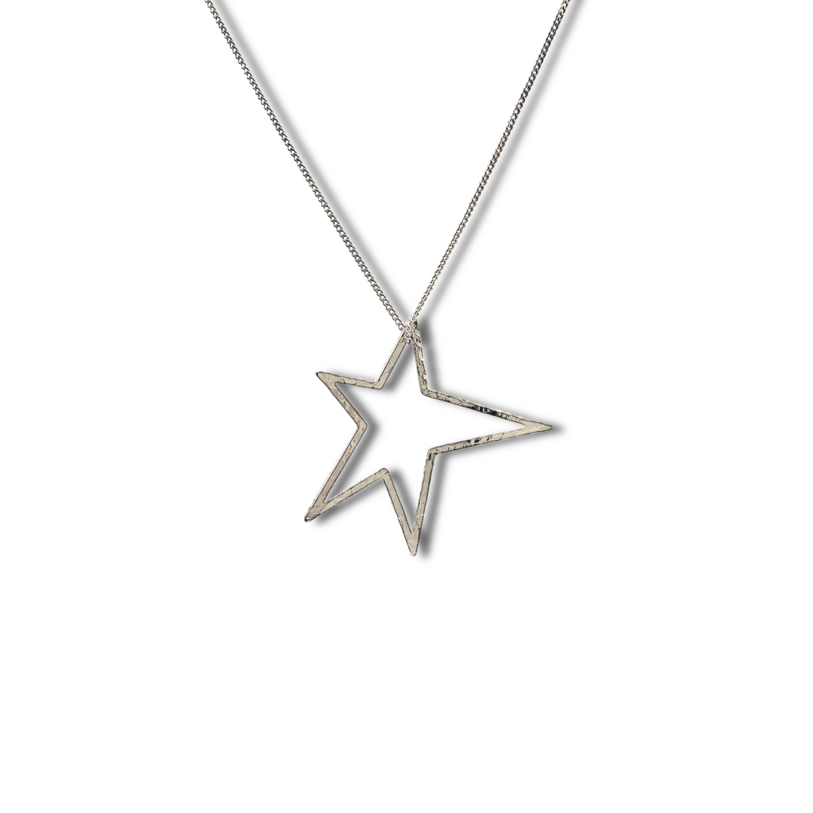 The Silver Shooting Star Dust Charm  Chain Necklace by JAREDJAMIN Jewelry Online features a rhodium plated chain with a large, hammered, hollow star pendant evoking shooting star dust, shown at an angle on a white background.