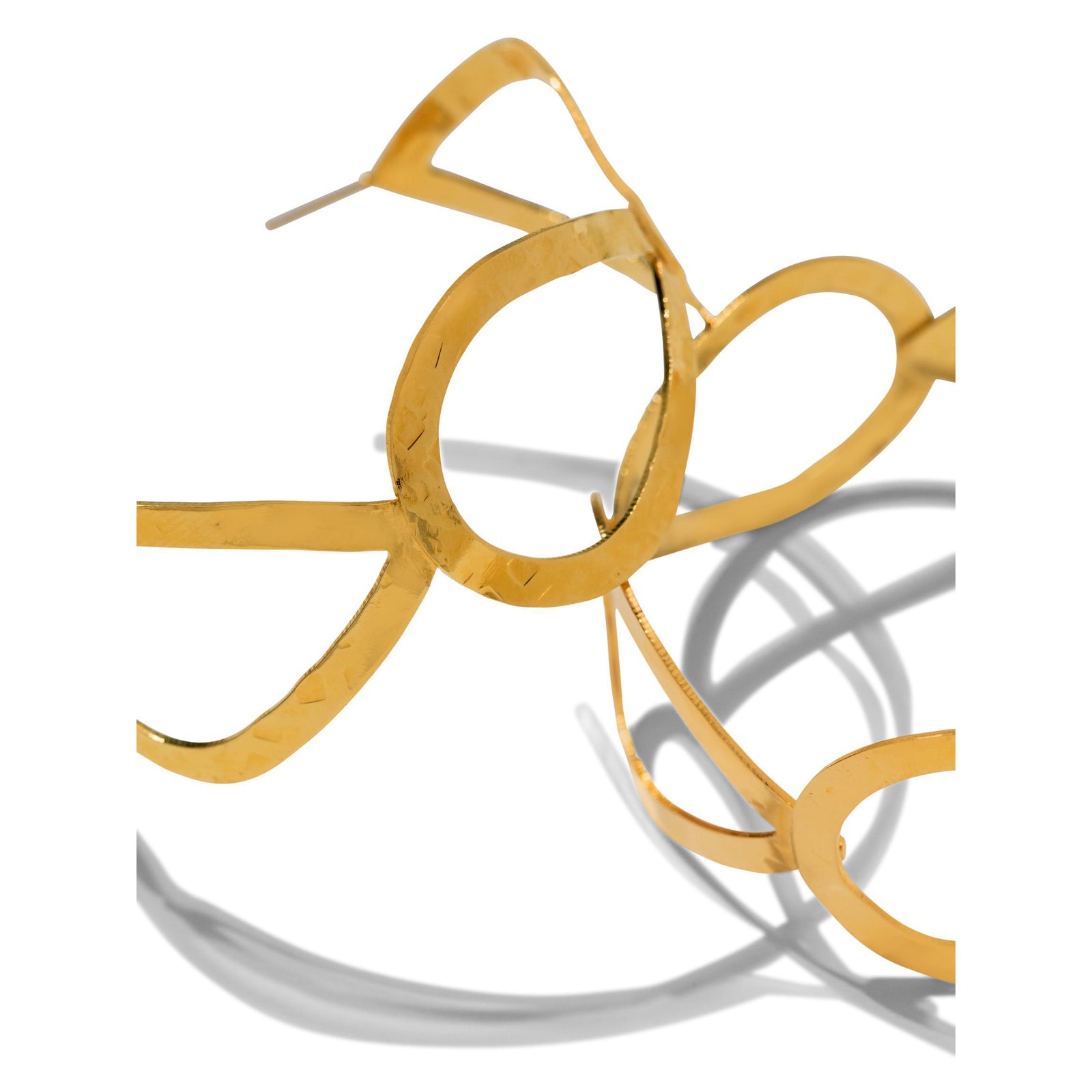 The Julia Hoop Post Earrings by JAREDJAMIN Jewelry Online feature large, abstract hoops in polished 18K gold. Their organic, wavy shapes and modern design are tarnish free for lasting shine. Perfect for a bold yet elegant look.