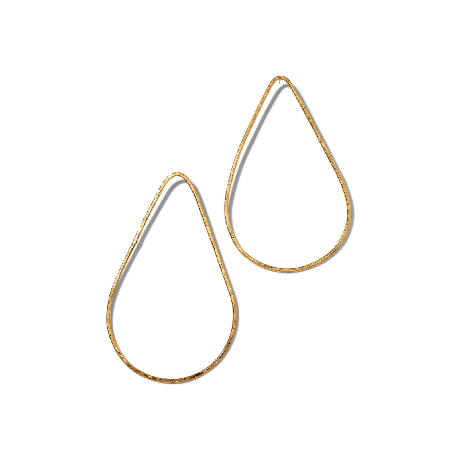 The Tereza Tear Post Earrings by JAREDJAMIN Jewelry Online feature two elongated, hammered 18K gold-plated metal drops with post fastenings, showcased on a white background for a minimalist, elegant style.