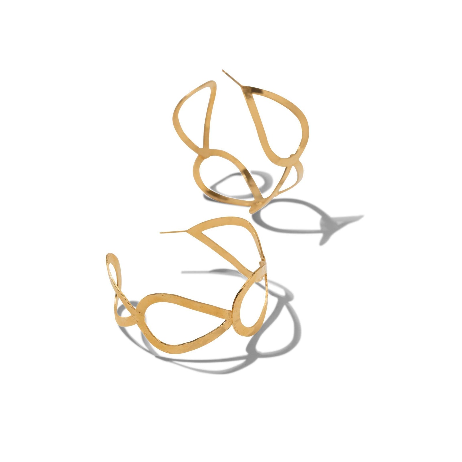 The Julia Hoop Post Earrings by JAREDJAMIN Jewelry Online feature large, abstract hoops in polished 18K gold. Their organic, wavy shapes and modern design are tarnish free for lasting shine. Perfect for a bold yet elegant look.
