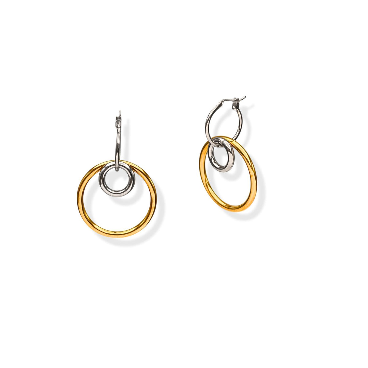 The Kahlo Dangle Two Tone Hoop Earrings by JAREDJAMIN Jewelry Online feature asymmetrical silver and gold hoops—one with the gold hoop outside the silver, the other inside—shown on a white background.