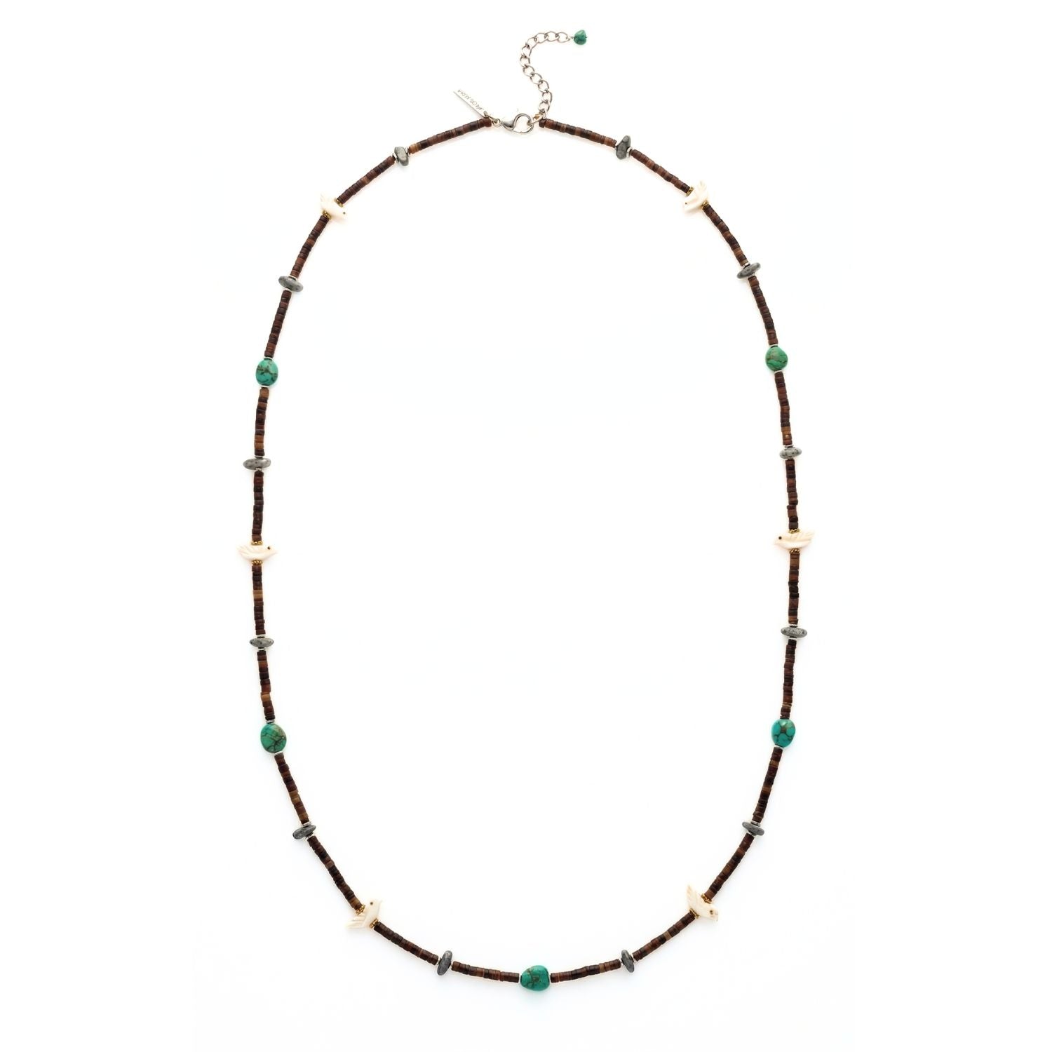 High-resolution studio product shot of the JAREDJAMIN Kai Necklace laid out in an oval configuration against a crisp white backdrop, showcasing the dark natural horn discs, turquoise pebbles, matte hematite stones, carved bird charms, and the sterling silver extension chain with clasp.
