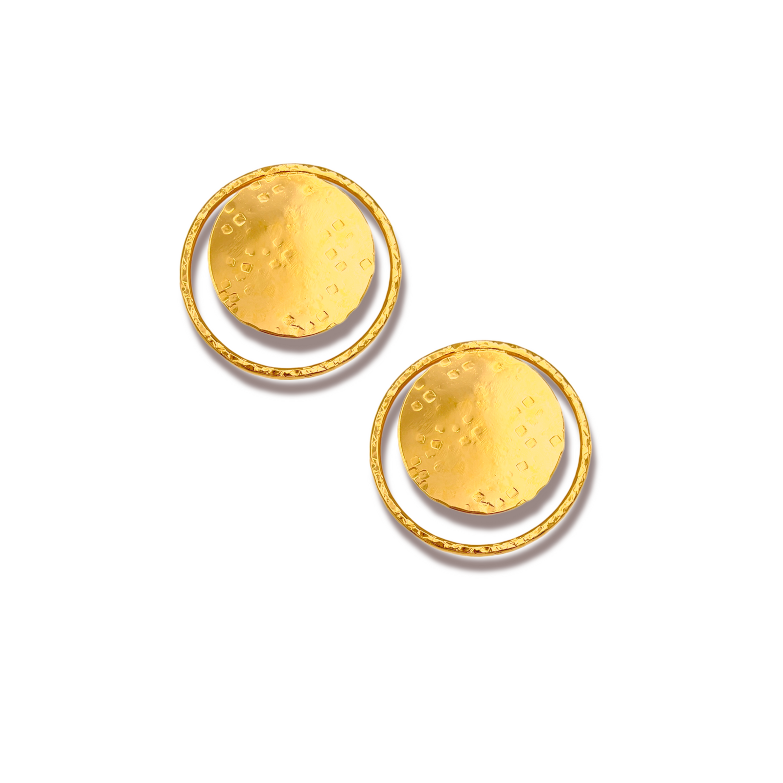 The Large Peacock Eye Post Earrings by JAREDJAMIN Jewelry Online feature hammered, textured gold circular disks partially enclosed by thin rings, boasting an uneven matte 18K finish and a minimalist design against a white background.