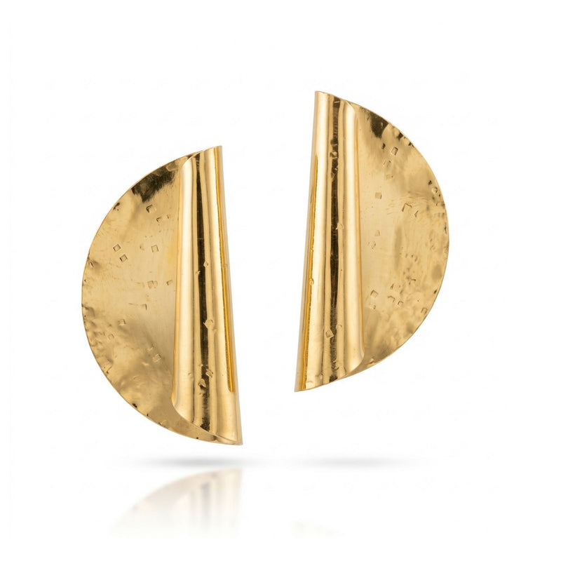 Large Scroll Earrings—hand-assembled in our West Hollywood studio—capture light across sculpted, asymmetrical curves. Forged from small-batch, eco-conscious 18k gold plate. Style Note: punctuates tailored blazers or elevates after-dark silks. Shown against white.