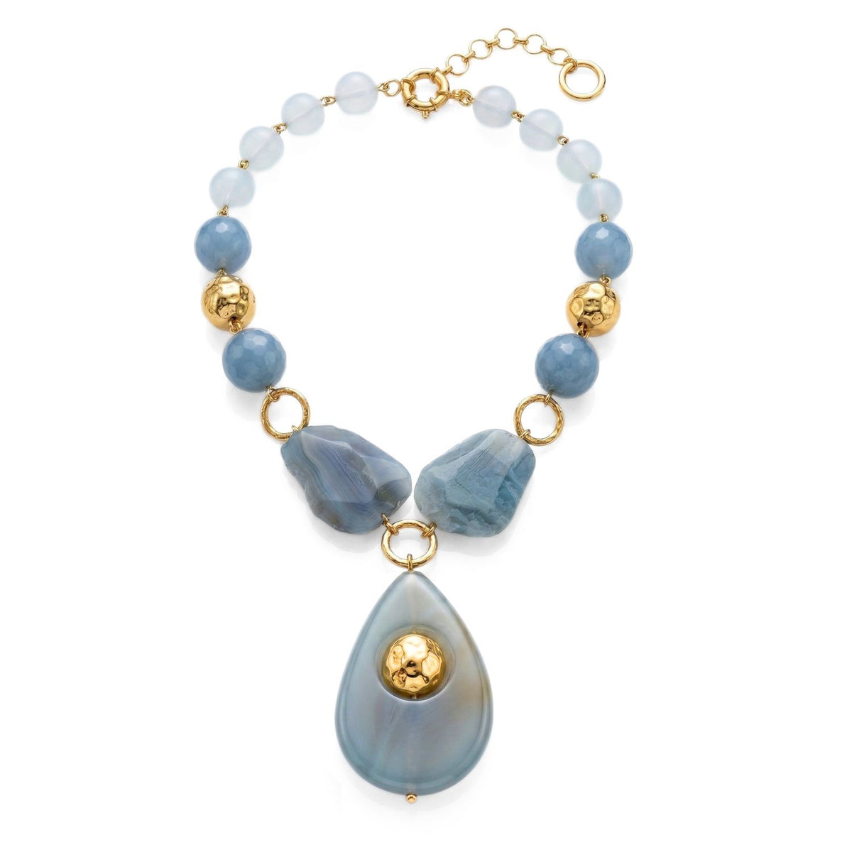 The Lumina Gemstone Necklace by JAREDJAMIN Jewelry Online features round blue beads, two irregular blue stones, gold accents, and a large teardrop-shaped blue agate pendant with gold detail on an adjustable gold chain.