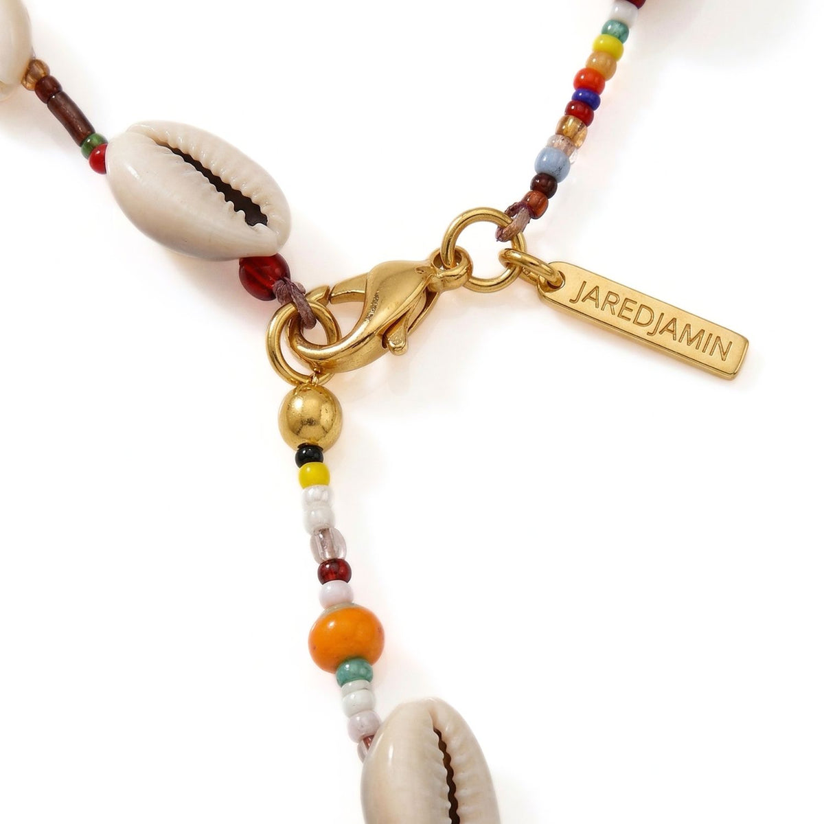 Close-up of the adjustable lobster clasp showing how to change the necklace from a Y-shape to a circular silhouette