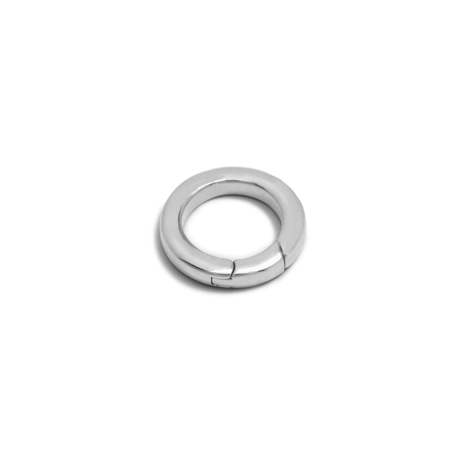 The Silver Medium Circular Clicker Clasp from JAREDJAMIN Jewelry Online showcases a sleek, minimalist silver design with a hinged clasp, highlighted against a plain white background.
