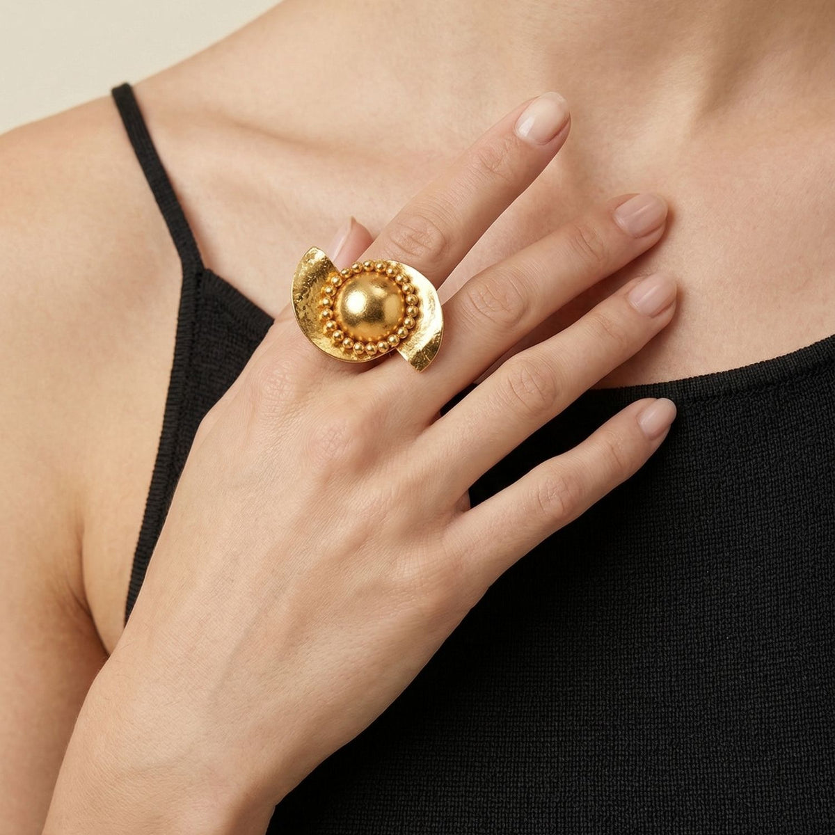 The Monsoon Swirl Gold Ring by JAREDJAMIN is a bold, size 6 piece featuring a round central detail and crescent-shaped brushed texture in gold. Artisanal craftsmanship West Hollywood, sustainable luxury, and signature finishes define this Essential.
