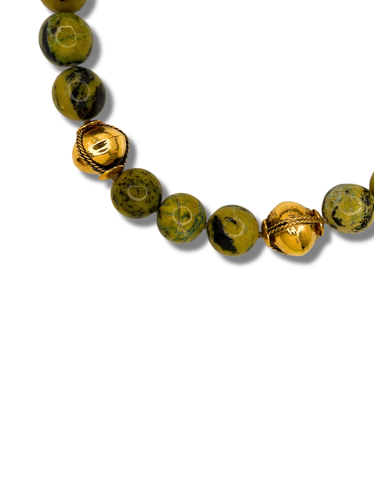 The Moss Maiden Necklace by JAREDJAMIN Jewelry Online features hand-knotted round green moss agate beads with black speckles, accented by two gold rope-textured beads, arranged on a plain white background.