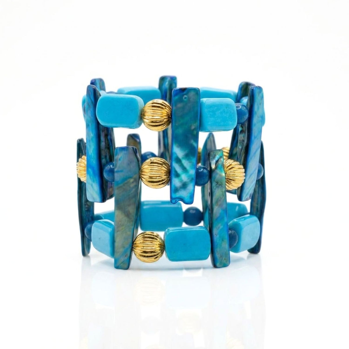 High-resolution studio product shot of the 2-inch JAREDJAMIN Nerida Shell & Chalk Turquoise Statement Cuff Bracelet displayed standing on a white background, highlighting its grid layout of vertical blue shell sticks, chalk turquoise rectangles, and ribbed gold beads.