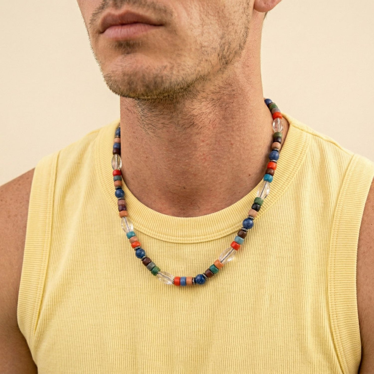 The Nomad Beaded Quartz Necklace—hand-assembled in our West Hollywood studio—punctuates his neckline with blue, red, green, and white gemstone beads. Crafted in mindful small batches for eco-conscious collectors. Style Note: seamless from tanks to tailoring.