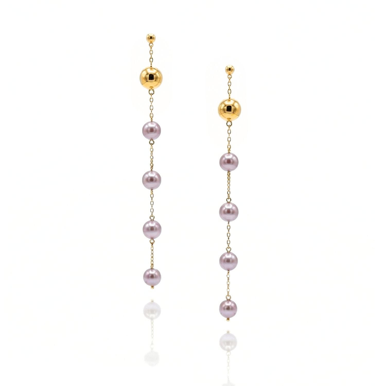 The Nora Dangle Pearl Lavender Earrings from JAREDJAMIN Jewelry Online feature 18k gold-plated posts with a thin chain and four round lavender freshwater pearls, displayed on a plain white background to highlight their elegance.