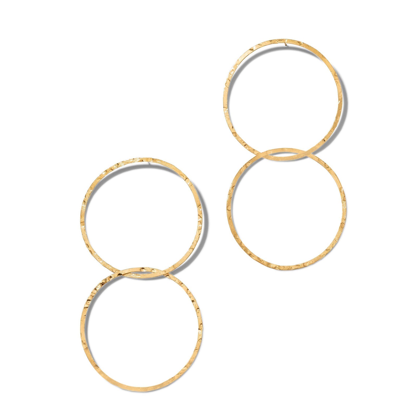 Two pairs of Gold Raquel Dangle Hoop Post Earrings by JAREDJAMIN Jewelry Online are displayed on a white background, each with two linked hoops in a figure-eight and a hammered, reflective 18K gold plate finish.