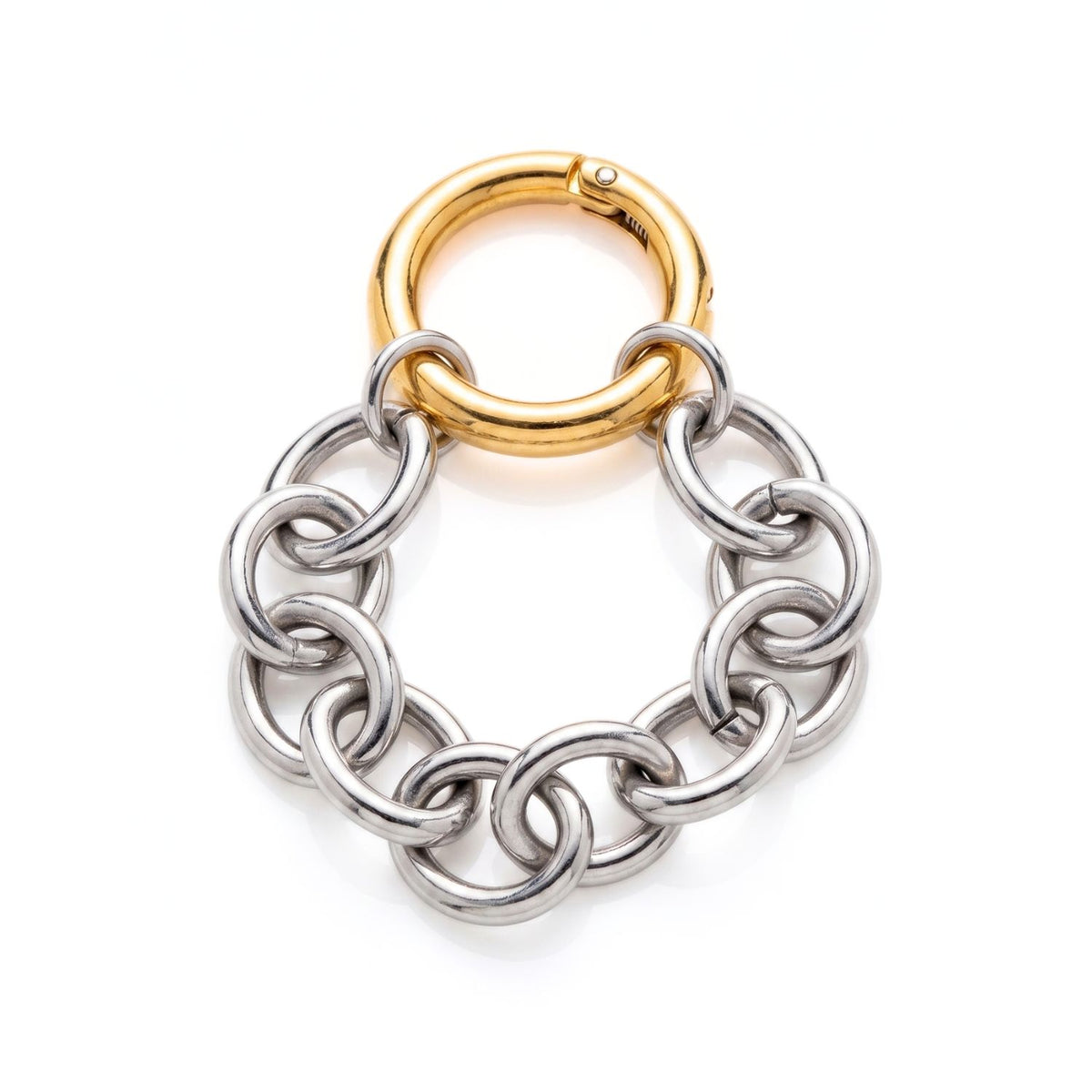 Studio product shot of the Silver Parker Link Chain Bracelet looped on a white background, highlighting the contrasting gold detachable clicker clasp against the silver chain.
