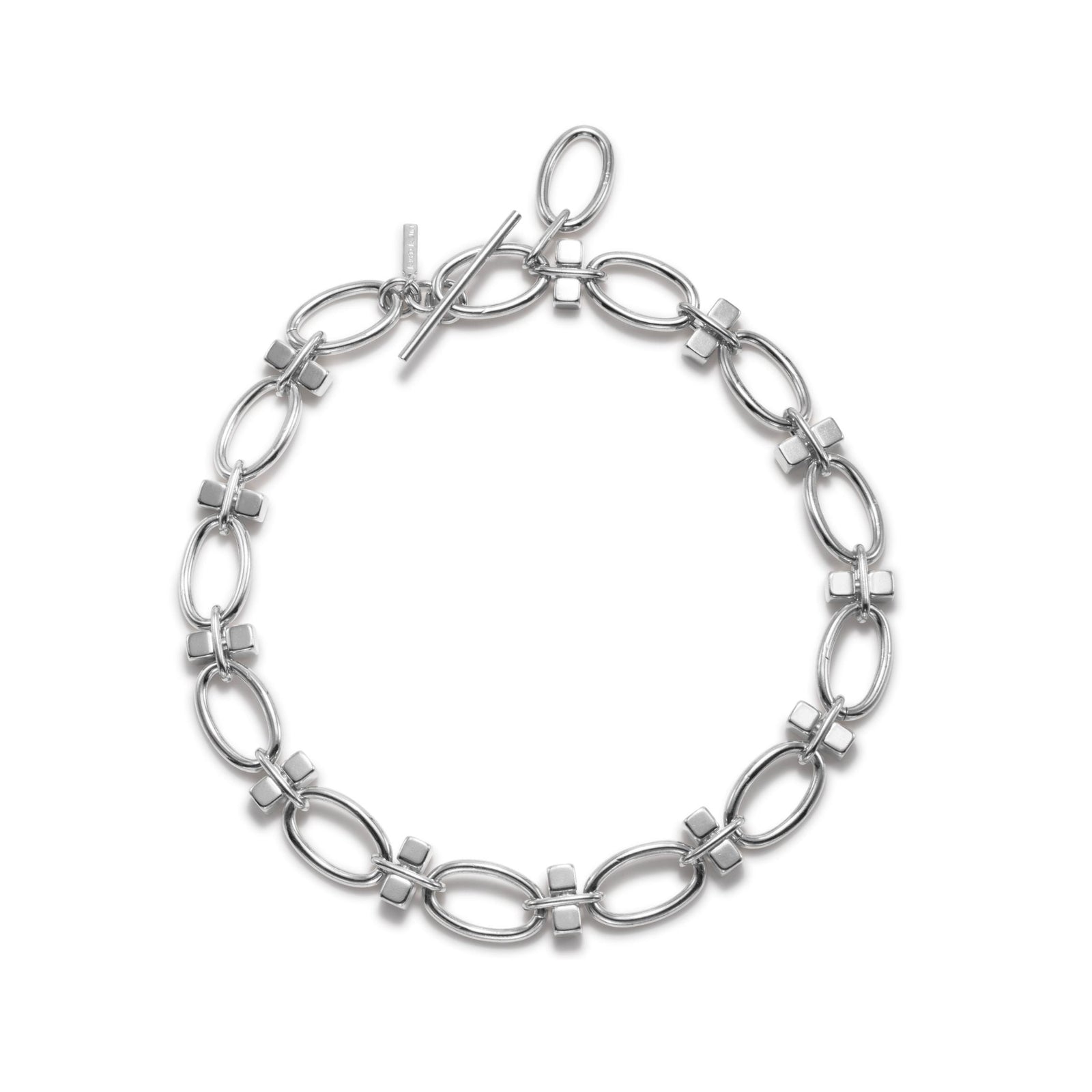 The Silver Reign Collier Necklace by JAREDJAMIN Jewelry Online features large oval links and small square connectors in silver-plated brass, forming a polished, reflective circle secured with a toggle clasp.