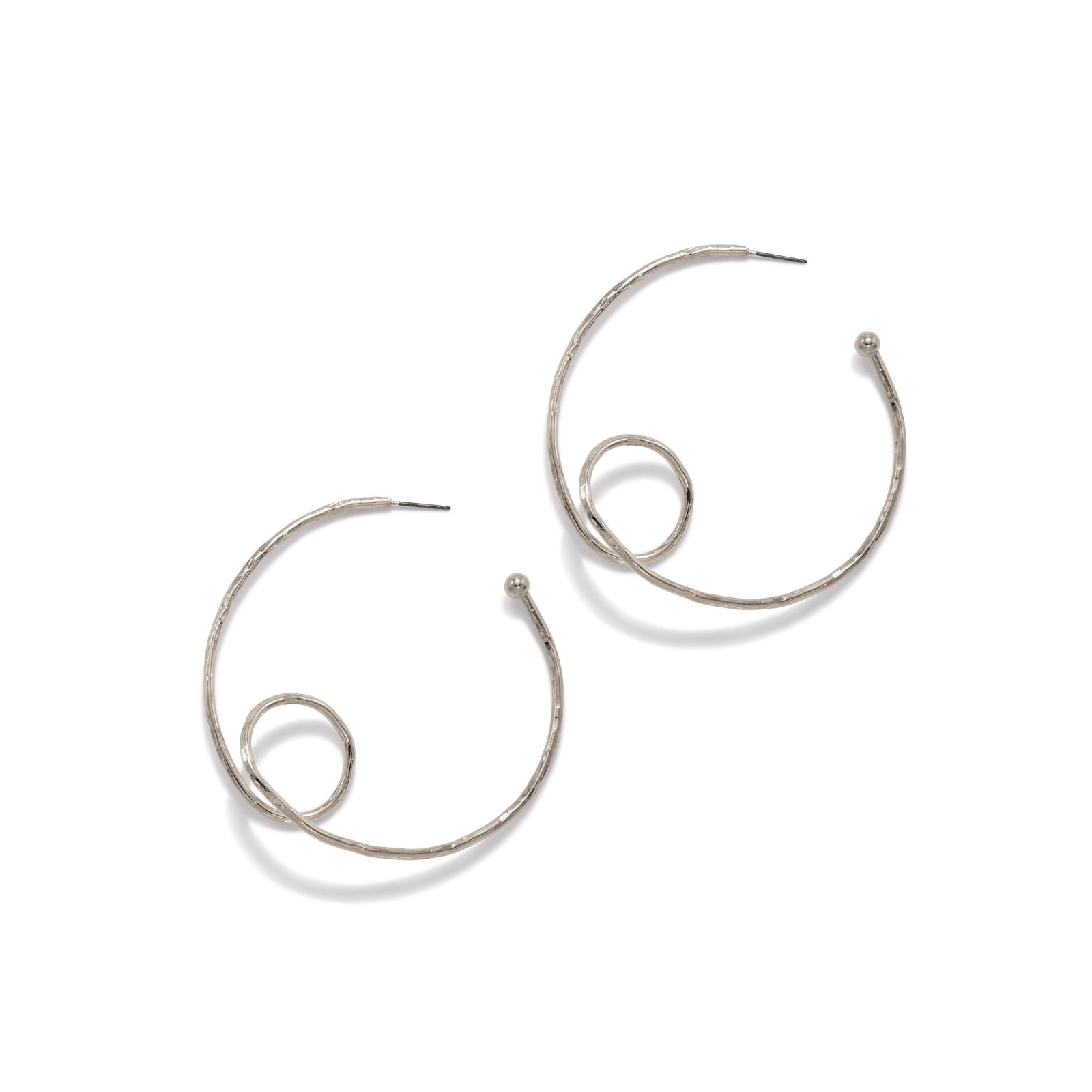 The Silver Loop-De-Loop Hoop Post Earrings by JAREDJAMIN Jewelry Online are silver-plated brass hoops with a hammered texture and spiral loop detail, shown overlapping on a white background in a modern, artistic style.