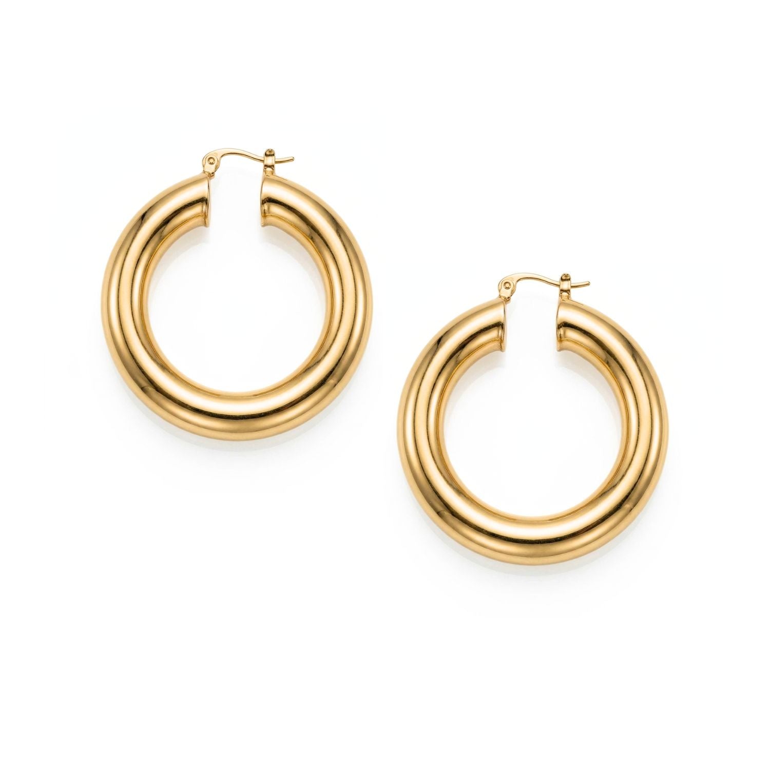High-resolution studio product shot of both Aurelia chubby gold hoops resting flat, highlighting their circular 1.5-inch geometry, high-shine polish, and hinge mechanisms.