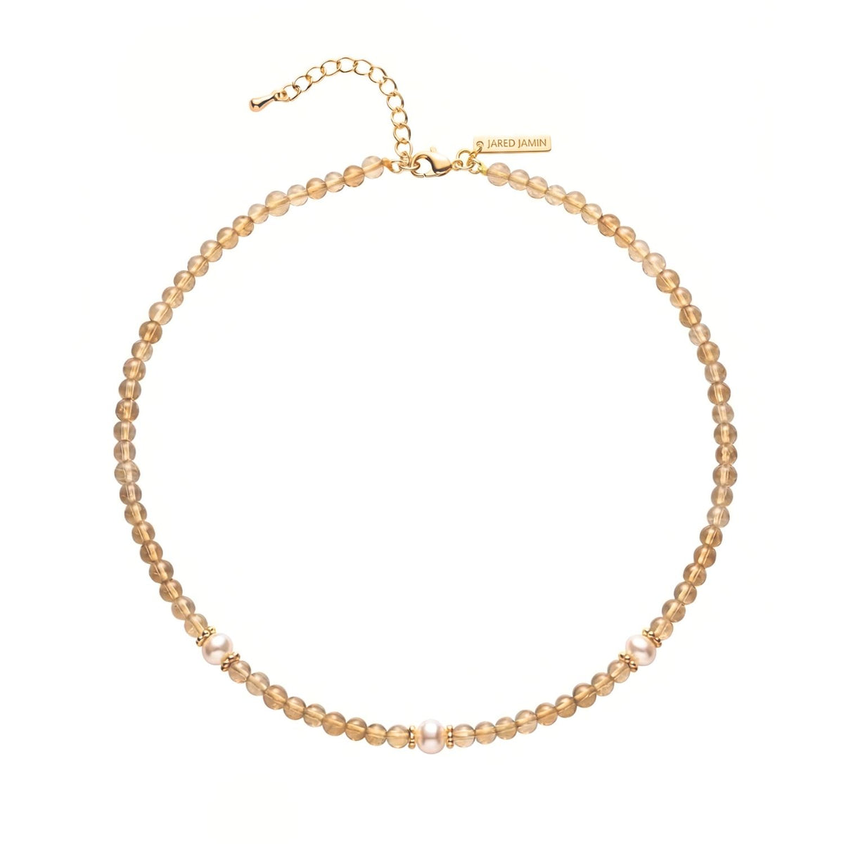 Los Sand Bar Sensation Citrine collar de JAREDJAMIN Joyería Online features bañado en oro champagne beads, three white perla clusters, an adjustable oro cadena, y a branded engraved tag. mostrado sobre a fondo blanco.