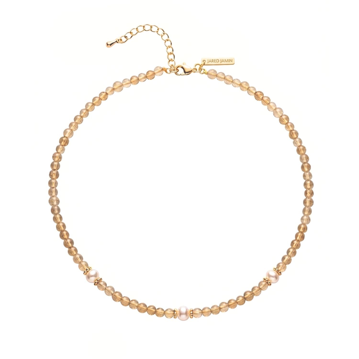 The Sand Bar Sensation Citrine Necklace by JAREDJAMIN Jewelry Online features gold-plated champagne beads, three white pearl clusters, an adjustable gold chain, and a branded engraved tag. Shown on a white background.