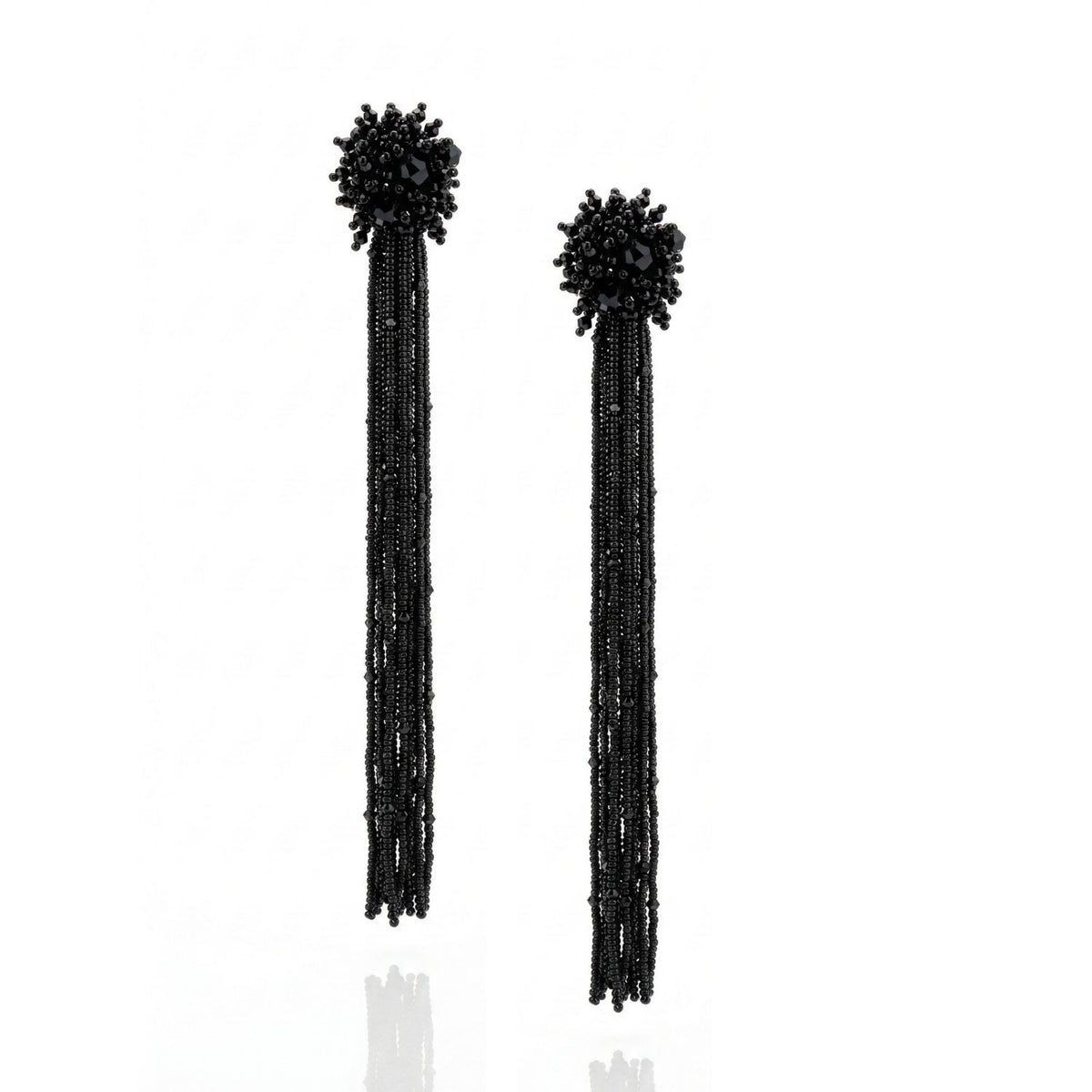 The Serafina Beaded Clip Earrings by JAREDJAMIN Jewelry Online feature hand-embroidered black bead clusters and cascading glass crystal strands, creating an elegant, eye-catching fringe effect.
