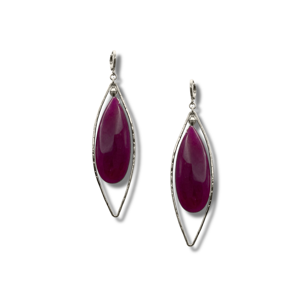 The Seraphine Plum Drop Leverback Earrings by JAREDJAMIN Jewelry Online feature teardrop plum quartz stones in open hammered silver-tone frames, offering a chic and modern accent to any outfit.