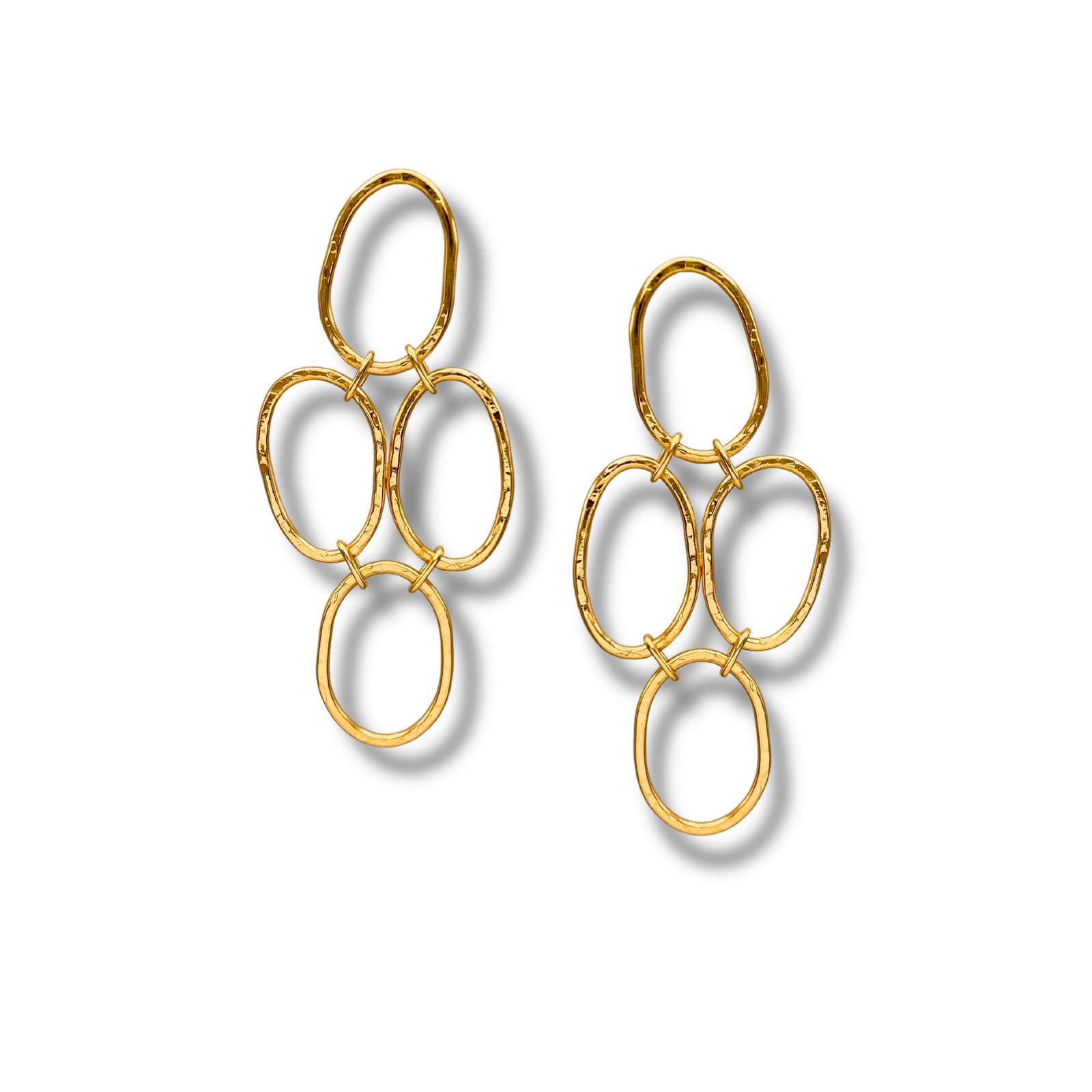 The Shackleford Chandelier Post Earrings by JAREDJAMIN Jewelry Online feature four interlocking, hammered 18k gold oval shackle links in a modern, minimalist vertical design, casting soft shadows on a white background.
