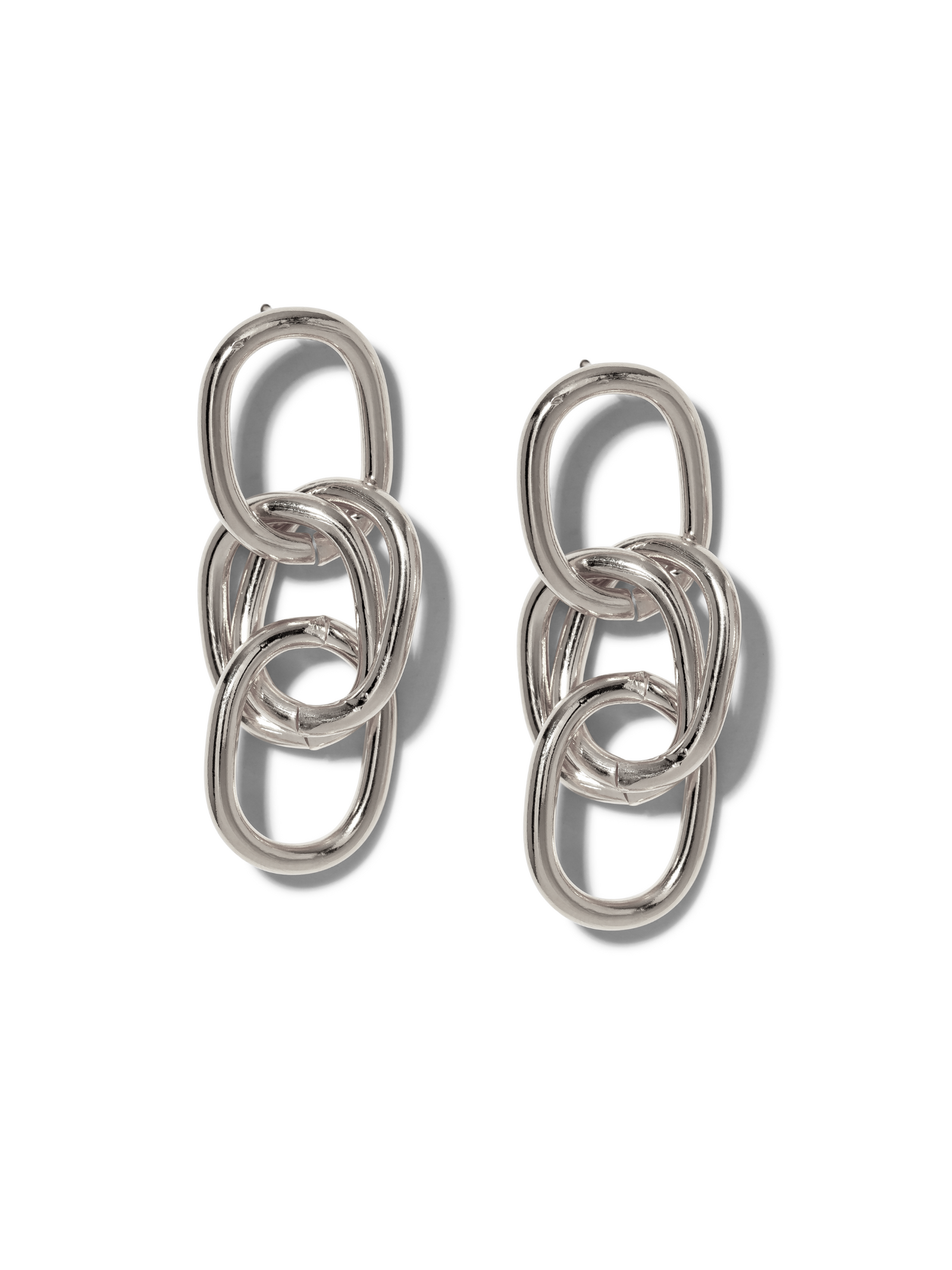 The Silver Billie Drop Post Earrings by JAREDJAMIN Jewelry Online feature three polished, interlocking oval loops in a vertical design, offering timeless chic and a soft glow from the Billie Collection.