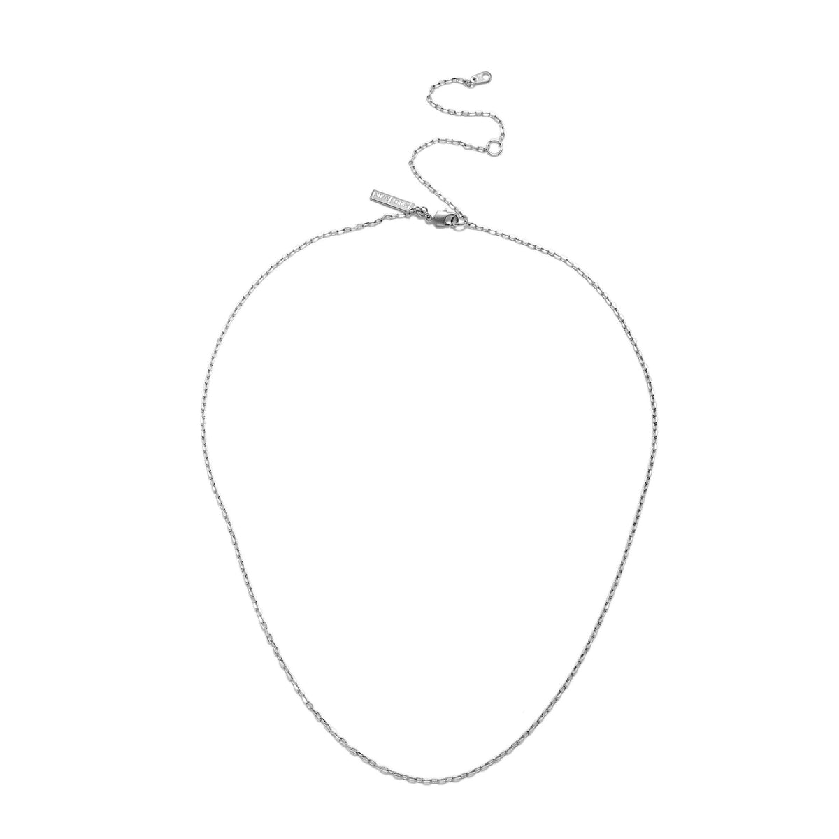The Chandler Adjustable Chain Necklace by JAREDJAMIN Jewelry Online features fine, subtly twisted silver links, a small lobster clasp with an extender, and a rectangular tag near the clasp. Shown oval-shaped on a white background.