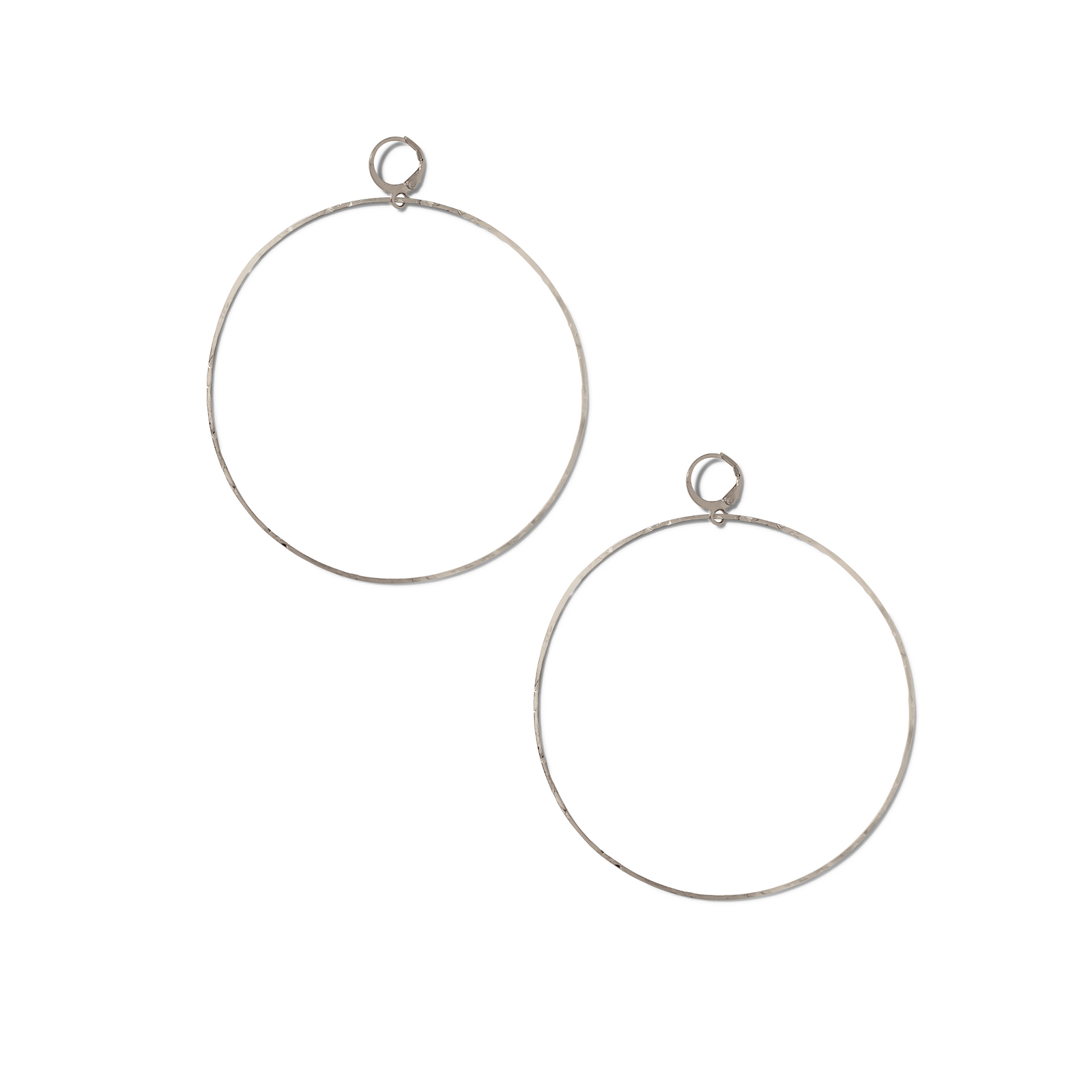 The JAREDJAMIN Jewelry Online Silver Halo Textured Hoop Earrings are large, thin hoops with a platinum-look finish and secure circular clasps, displayed on a white background for an elegant, minimalist touch.
