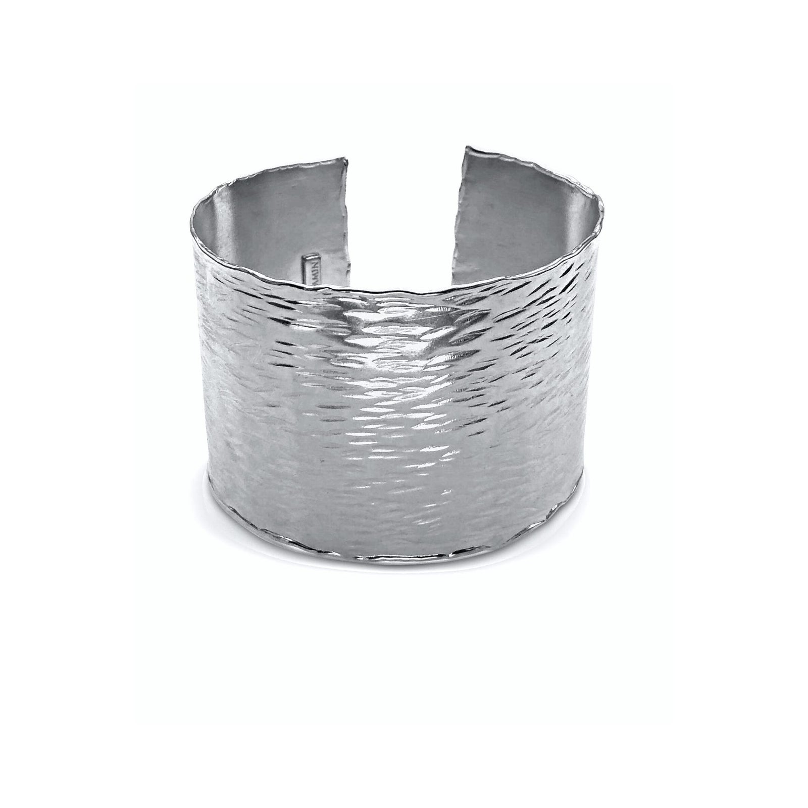 The Silver Hyde Cuff Bracelet by JAREDJAMIN Jewelry Online is a wide, open-ended cuff with wavy edges, a hammered texture, and reflective horizontal striations. Shown upright on a white background. One-size-fits-all.