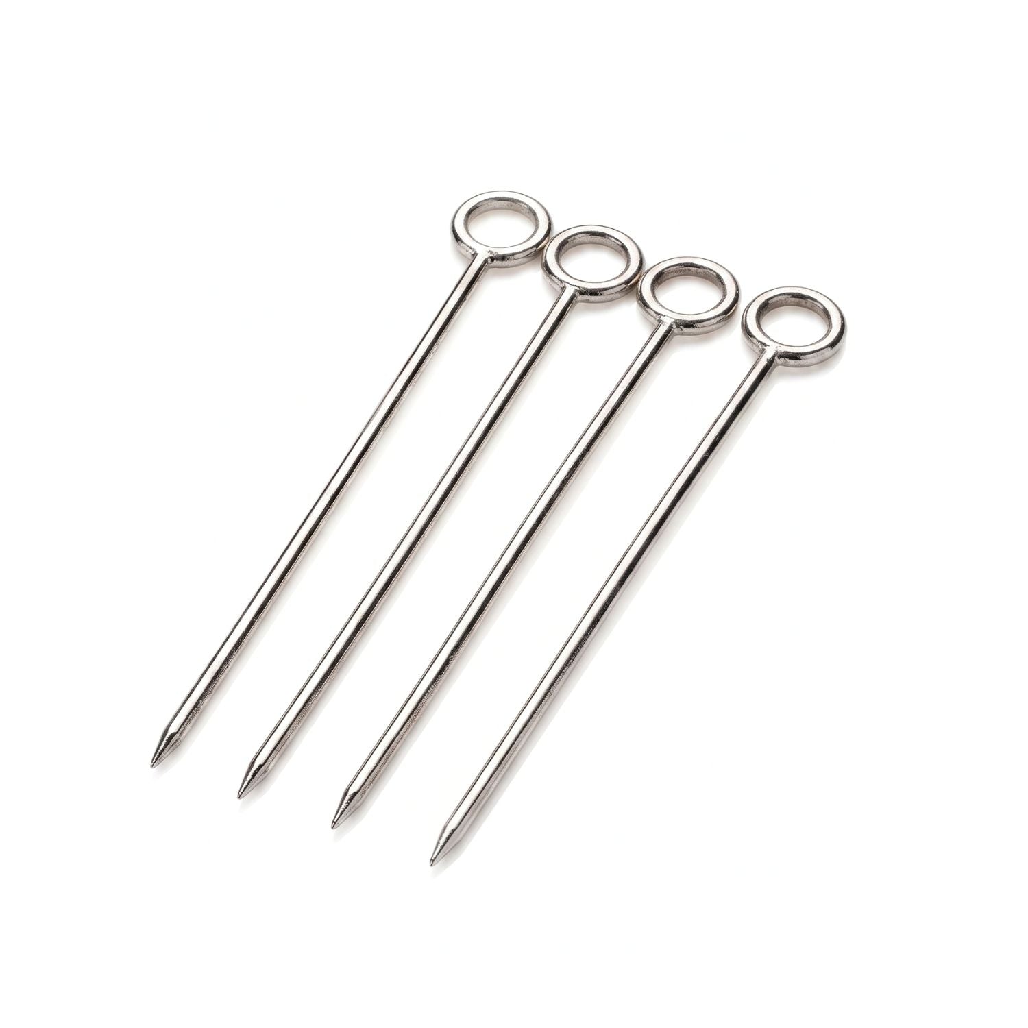Minimalist studio product shot of the set of four JAREDJAMIN Silver It's Five o' Clock Cocktail Skewers laid out diagonally, showcasing the sleek, high-polished silver-plated tapered shafts and the single circular ring handles that sit flat on top of the piques.