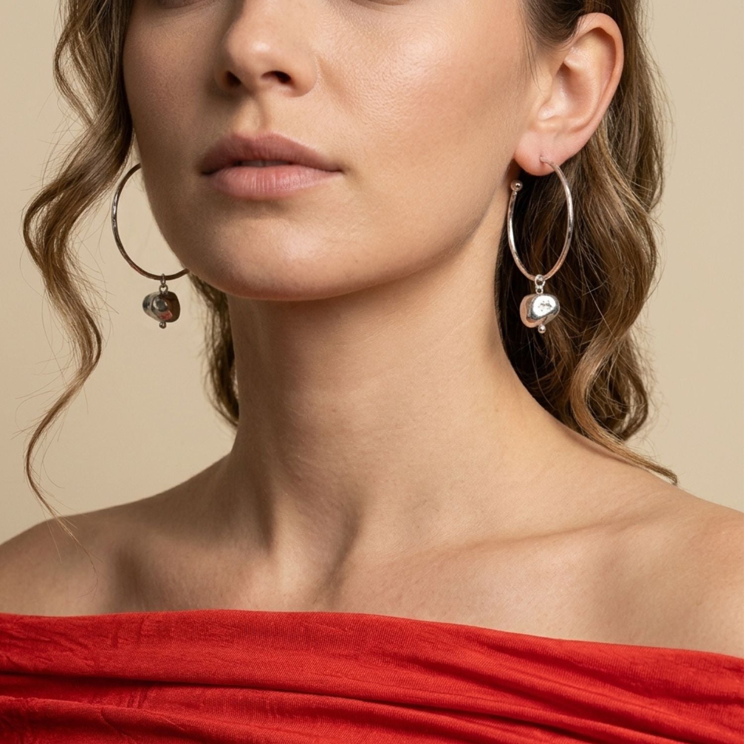 Isolated flat lay of the JAREDJAMIN Silver Nugget Earring Charms on a clean white surface, showcasing the organic, unpolished silver-plated nugget silhouettes and top suspension loops.