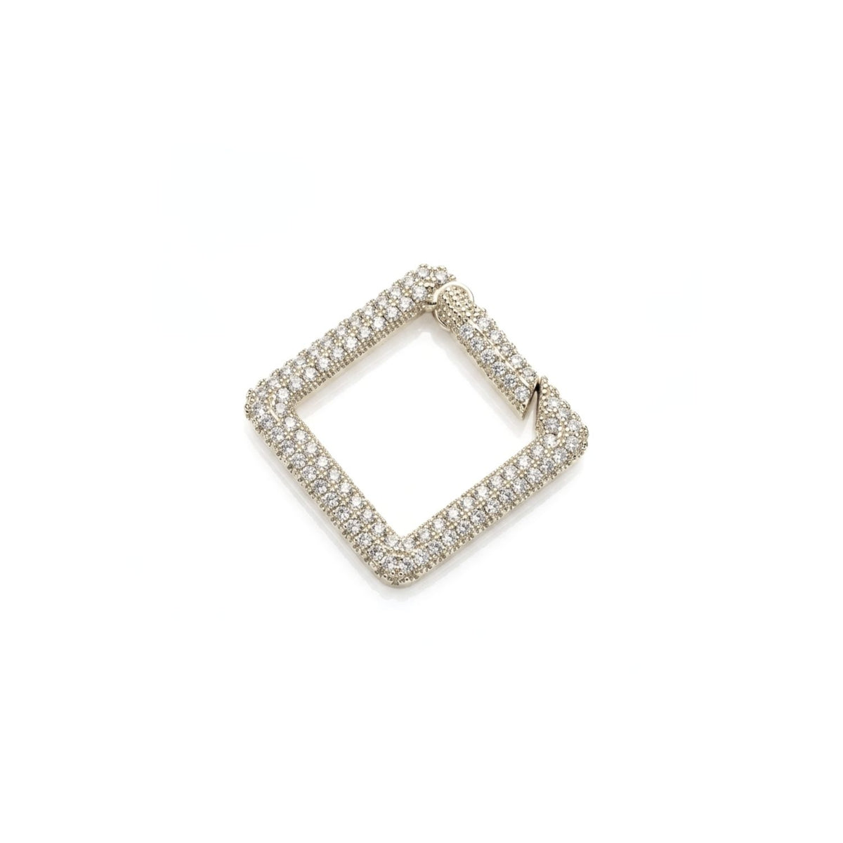 Studio macro shot of the high-polish silver plate JAREDJAMIN Pavé Square Clicker Clasp displayed flat against a white background, highlighting its sparkling CZ stones and push-gate hinge.