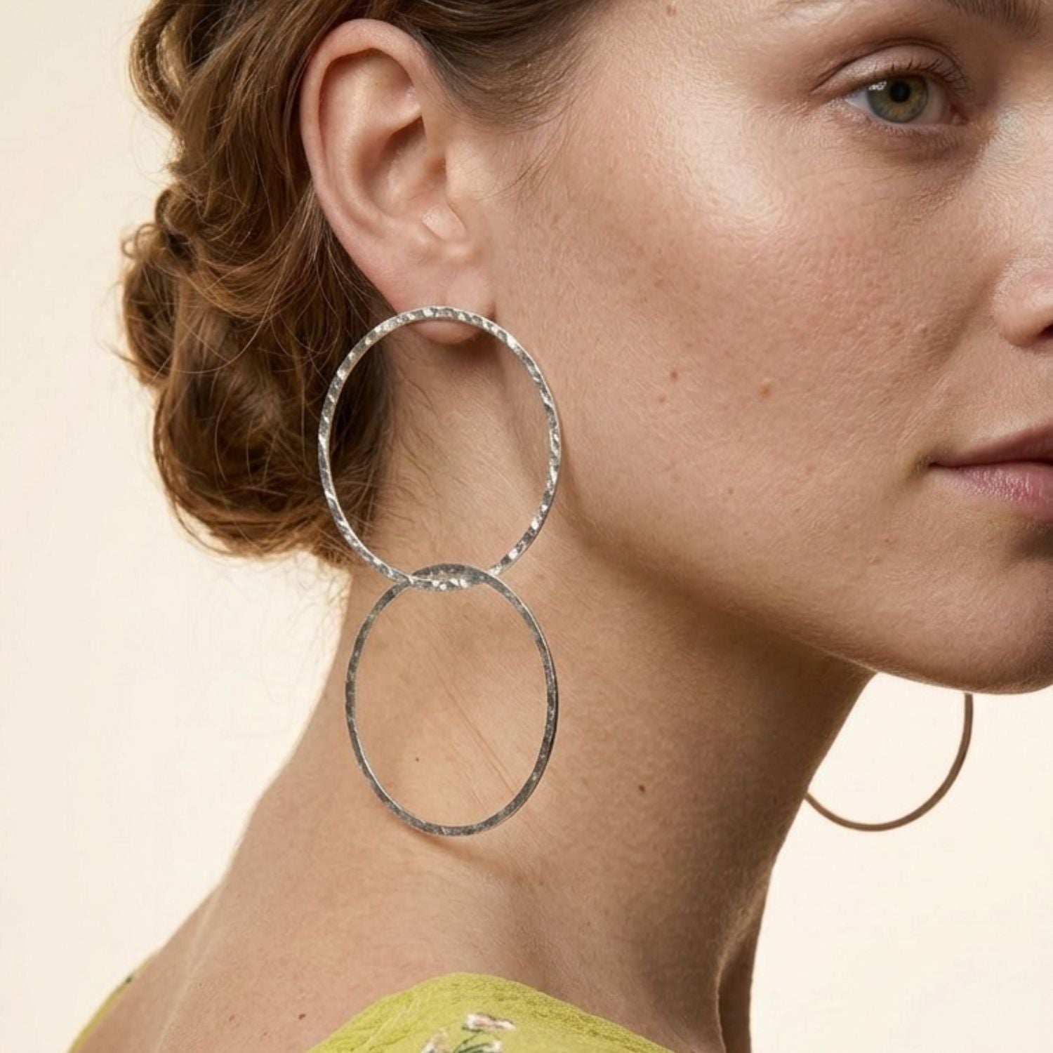 High-resolution studio product shot of the JAREDJAMIN Silver Raquel Dangle Hoop Post Earrings displayed flat on a white background, highlighting the 4.5-inch interlocking double hoop design and textured silver-plated finish.