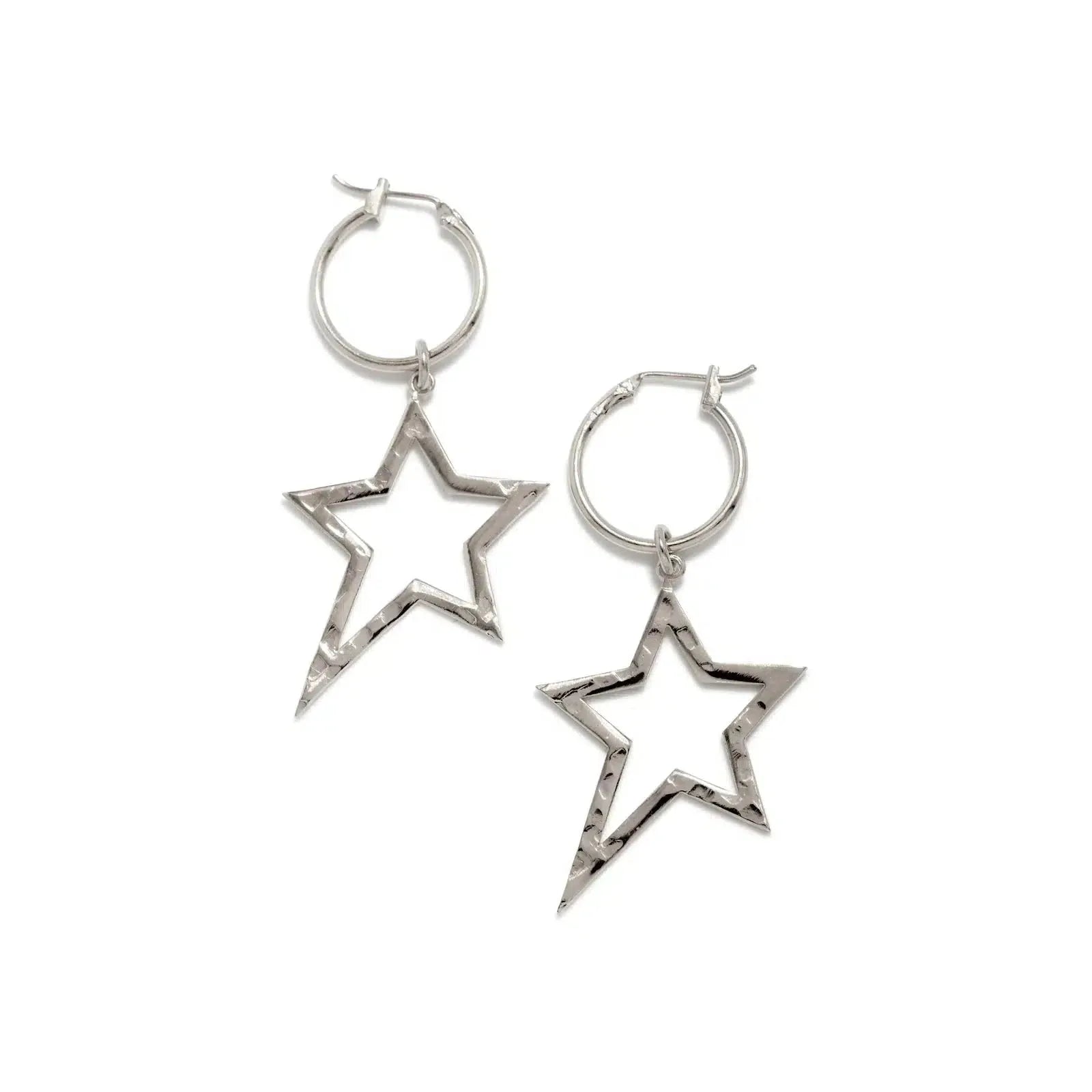 JAREDJAMIN Jewelry Online’s Silver Shooting Star Dust Earring Charms feature open-star shapes with textured edges, a silvery finish, and a minimalist design—each star tilting in opposite directions on a white background.