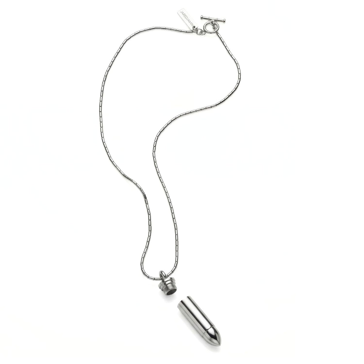 Sculpted in our West Hollywood studio, the Silver Scaramanga Capsule Necklace punctuates any look with its stainless steel, bullet-form pendant—revealing a hidden chamber. Hand-assembled in small batches with recycled metals. Style note: sharp from suiting to denim.