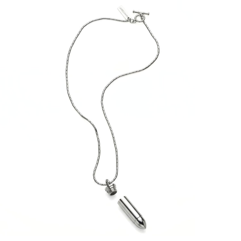 Sculpted in our West Hollywood studio, the Silver Scaramanga Capsule Necklace punctuates any look with its stainless steel, bullet-form pendant—revealing a hidden chamber. Hand-assembled in small batches with recycled metals. Style note: sharp from suiting to denim.
