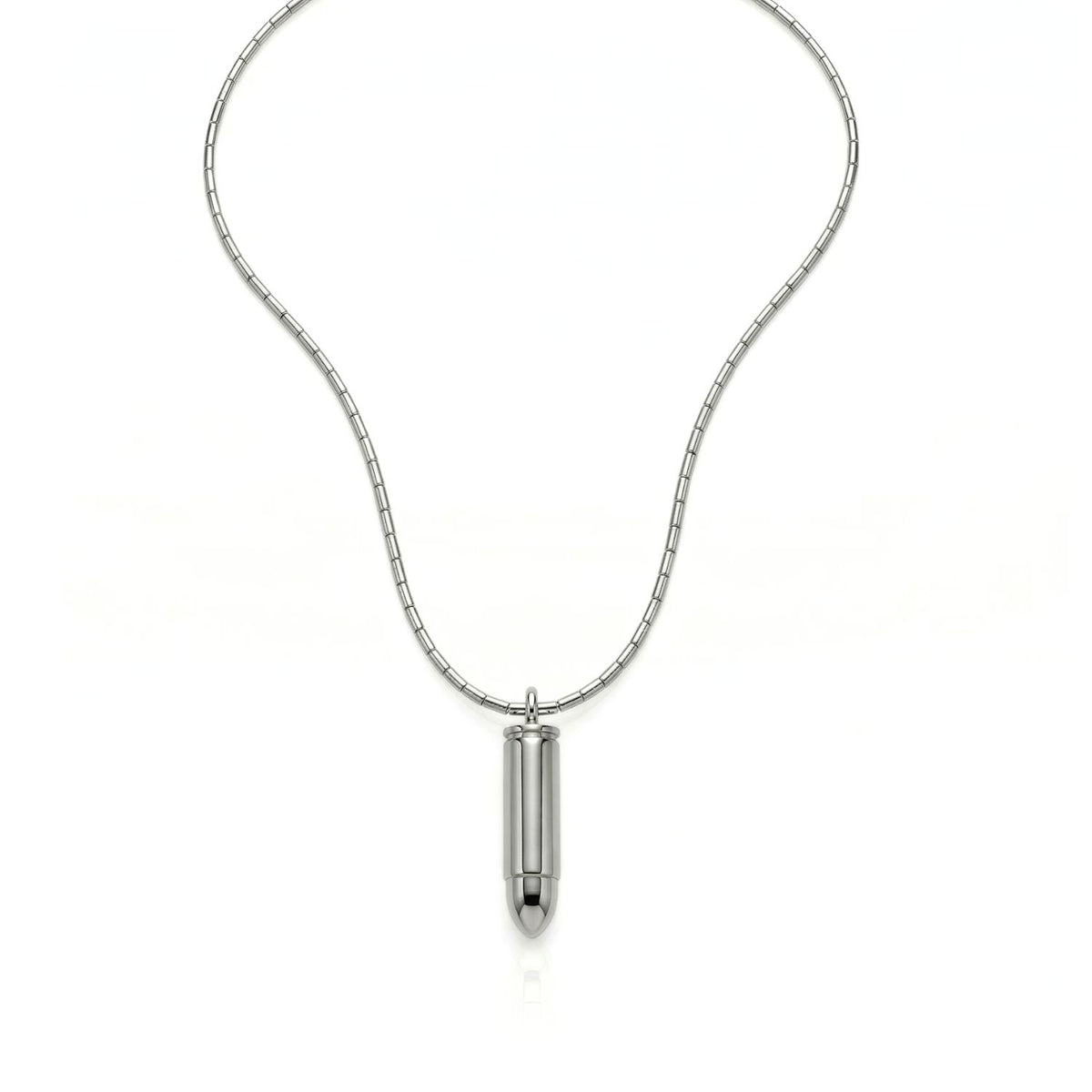 The Silver Scaramanga Capsule Necklace refracts clean geometry in hand-assembled stainless steel, crafted in our West Hollywood studio. Small-batch and eco-minded. Style Note: punctuates crisp tailoring or slip seamlessly under an open silk shirt.