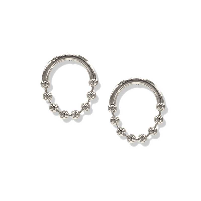 Pair of silver open-circle post earrings on white, each with a thick polished upper arc and a lower arc of small silver spheres.