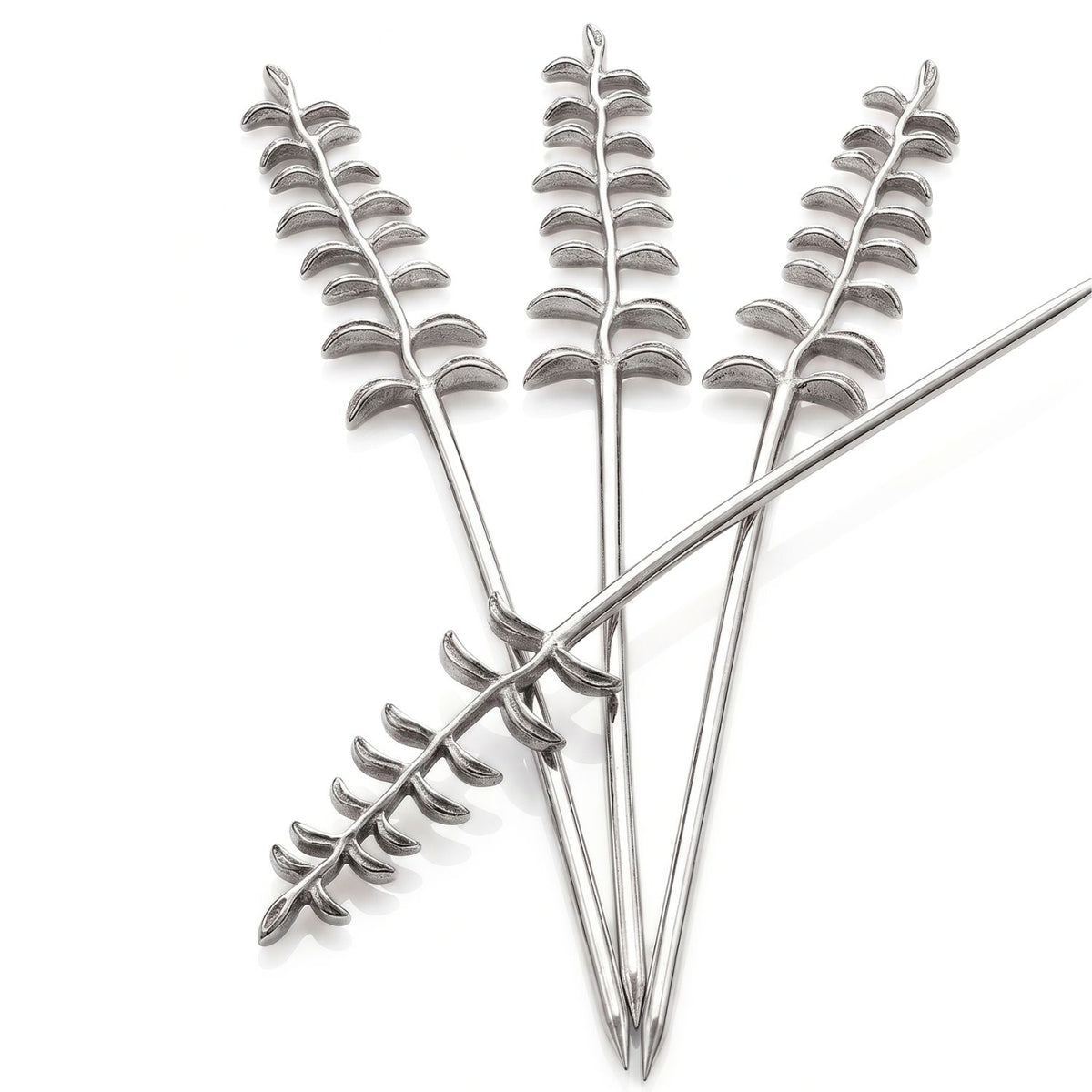 Close-up studio product shot of the four silver-plated thyme skewers crossed over one another against a clean white background, demonstrating the intricate leaf detailing, crisp reflections, and architectural uniformity of the textured handles.
