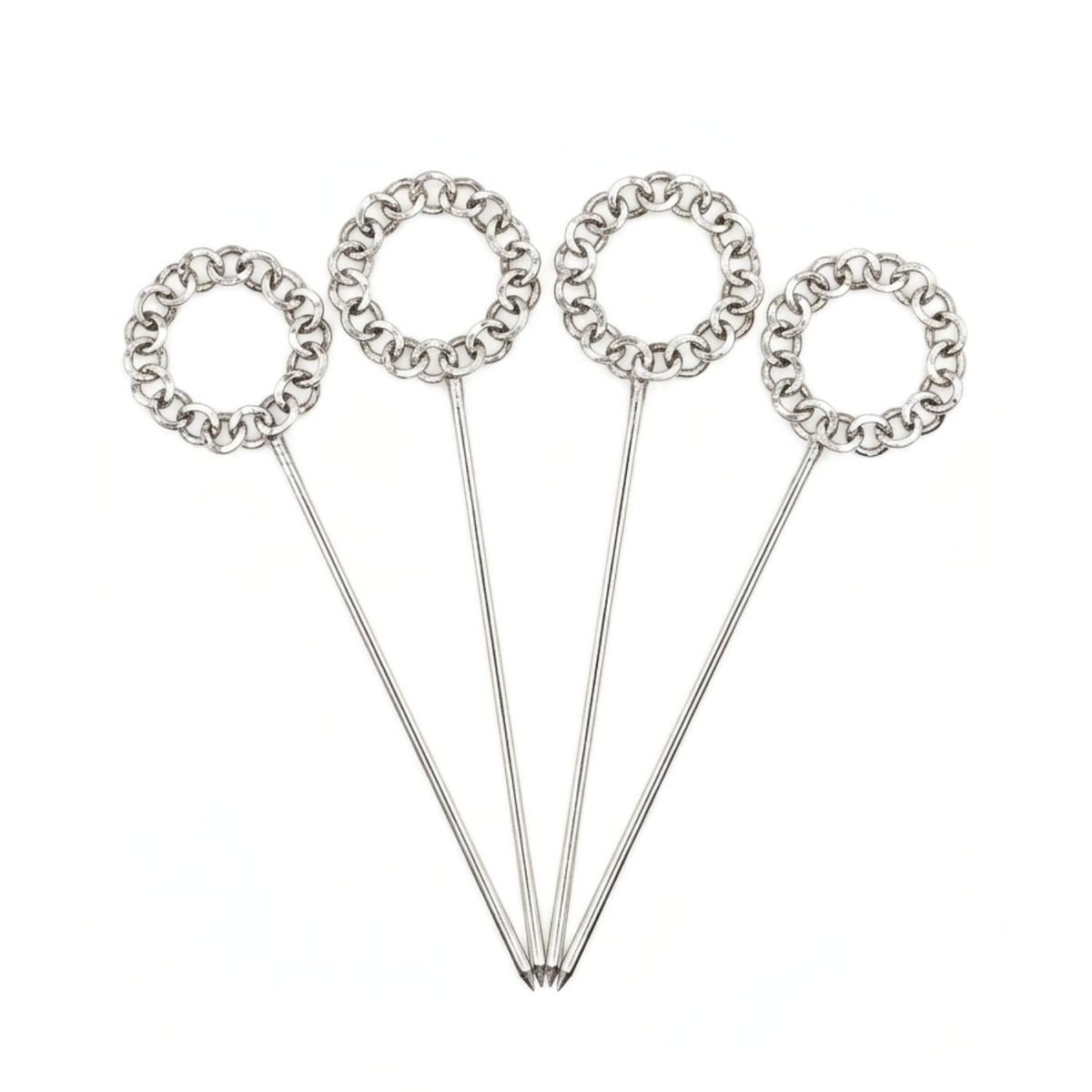 Studio product shot of the JAREDJAMIN Silver Wreath Cocktail Skewers set against a clean background, highlighting the four uniform, polished silver-plated piques with their distinct interlocking chain-link wreath handles arranged in a wide fan layout.