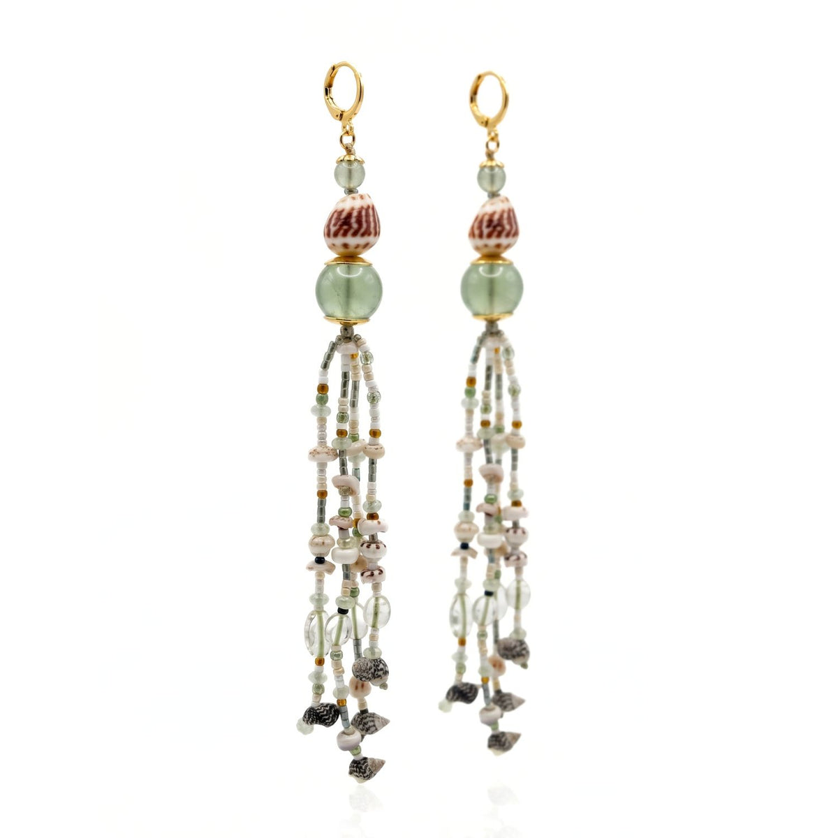 Studio product shot of the JAREDJAMIN Sirena Tassel Earrings, showcasing the 18k gold-plated lever clasps, stacked green fluorite spheres, pattern-banded recycled natural marine shell beads, and the sweeping 6.5-inch micro-fringe strands tipped with upcycled sea shells.