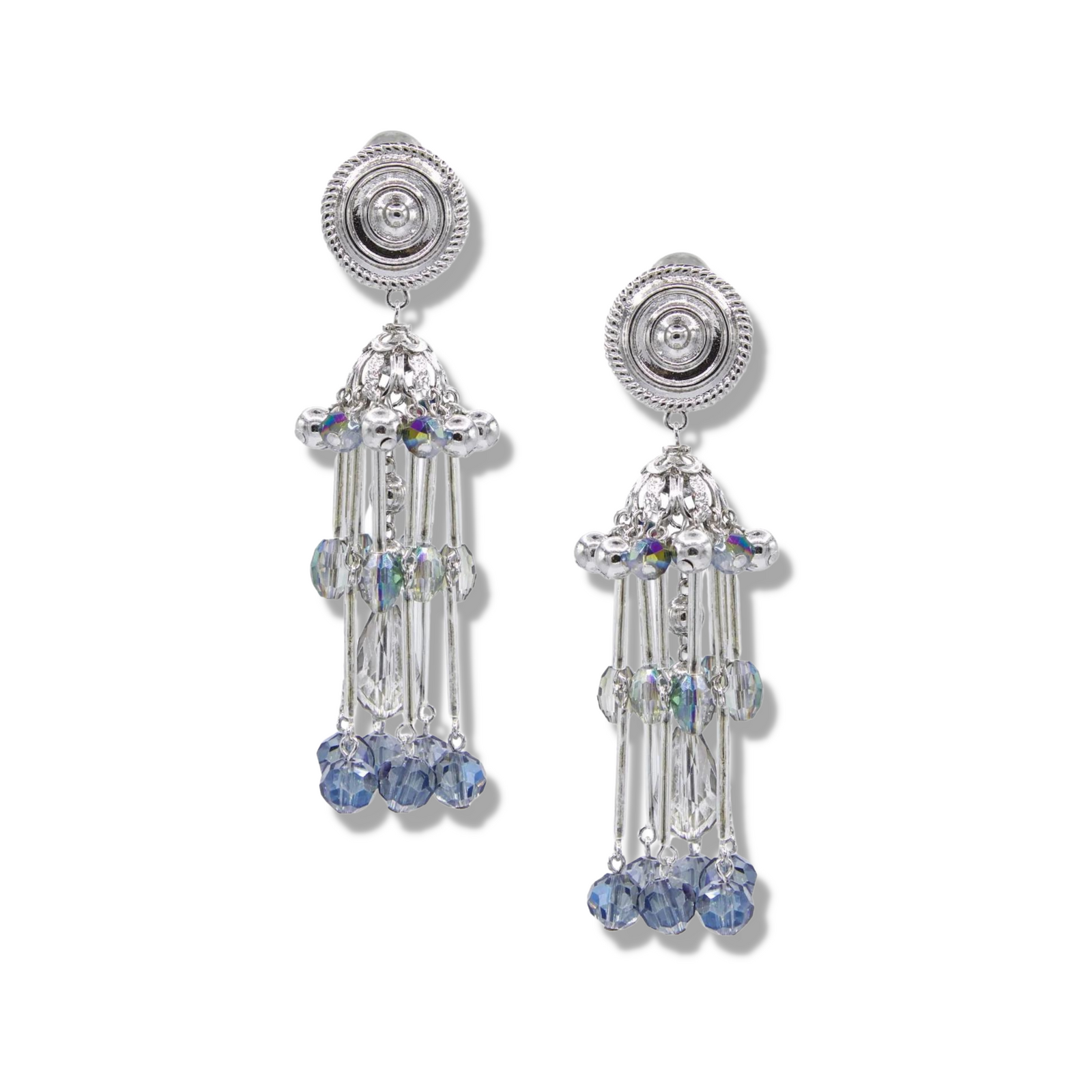 The Sixties Solar Sister Clip On Earrings by JAREDJAMIN Jewelry Online feature silver-tone chandeliers with circular studs, cascading iridescent crystals, faceted light blue beads, and silver plated components for a chic tiered look.