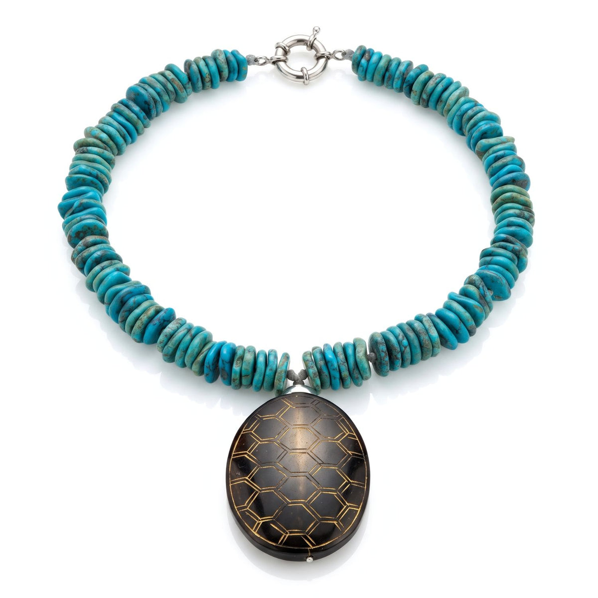 Studio product shot of the 17-inch JAREDJAMIN Solana Turquoise Howlite & Carved Jade Pendant Collar Necklace displayed flat in a loop, showing the turquoise disc beads, carved brown jade oval, and silver spring-ring clasp.