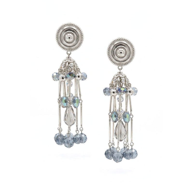 Hand-assembled in our West Hollywood studio, these small-batch, eco-conscious Sixties Solar Sister Clip-Ons refract light through faceted blue and clear beads. Dangling rods and sculpted silver capture vintage edge. Style Note: punctuates both white poplin and silk.
