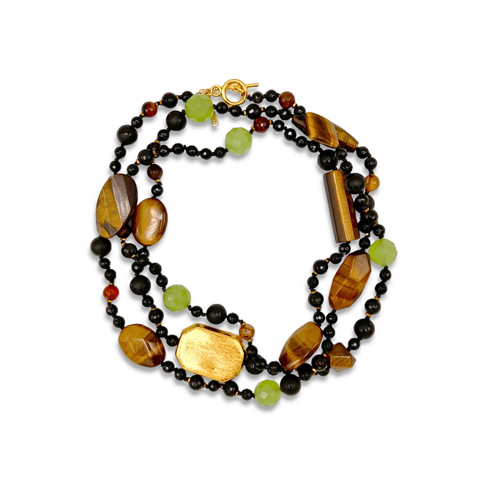 The Sorrento Gemstone Knotted Necklace by JAREDJAMIN Jewelry Online features multiple strands of polished tiger’s eye, faceted green quartz, onyx beads, and gold accents, all secured with a gold toggle clasp.